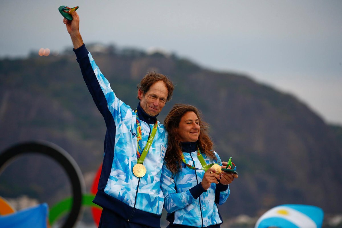 Cancer survivor Santiago Lange, with sailing partner Cecilia Carranza, winning gold medals for Argentina during the last Olympic Games.  Image credit:  Straits Times
