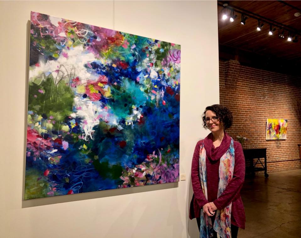 Portland artist Paulette Insall at her local art exhibition at art gallery in Portland's Pearl District