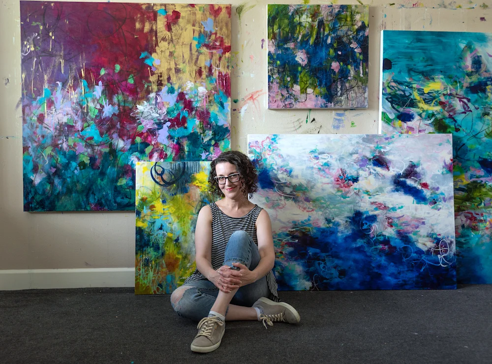 paulette insall top portland artist in art studio with paintings in progress.jpeg