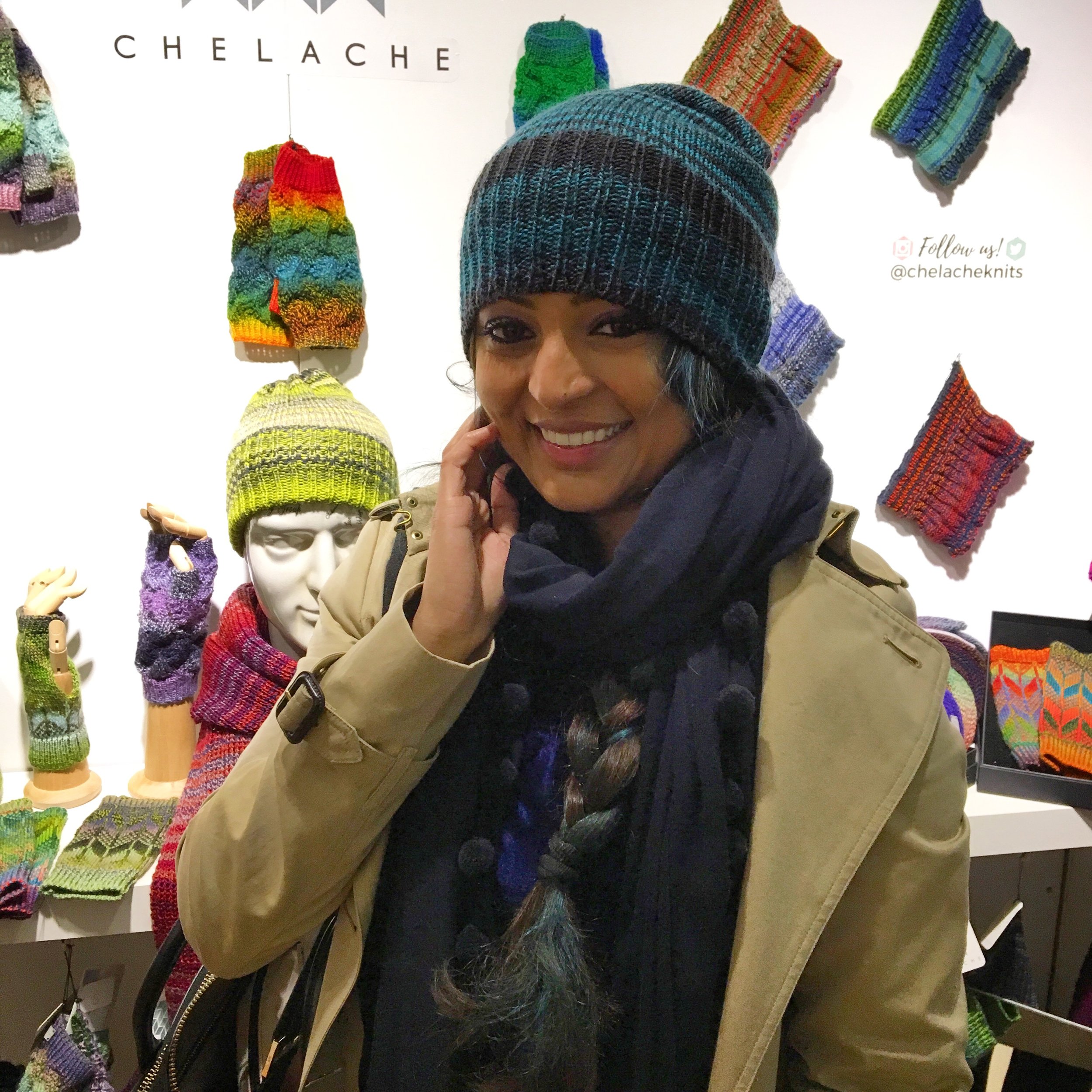 A happy customer wearing a CHELACHE beanie hat