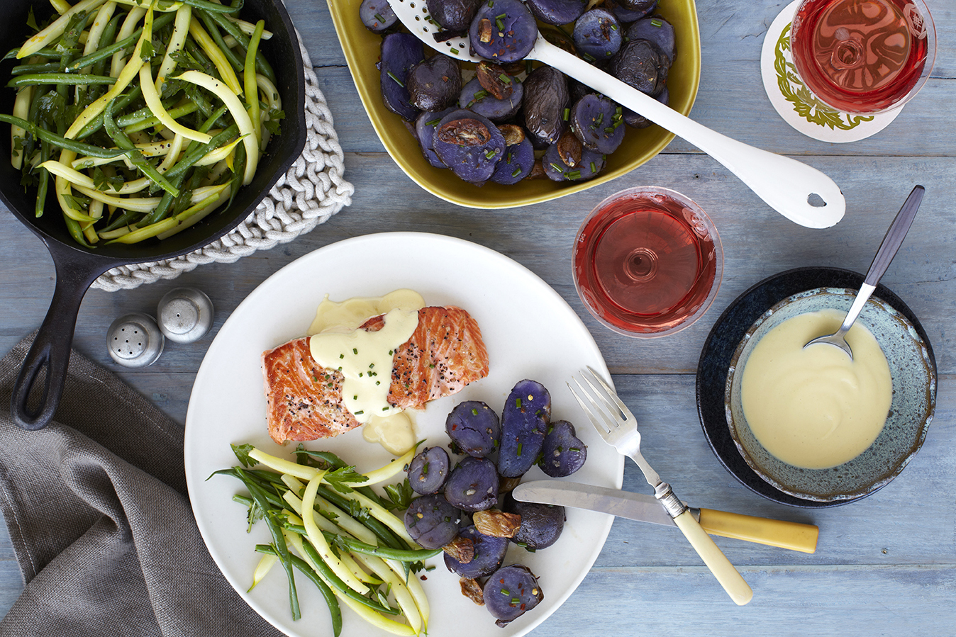 Pan-seared salmon with a dollop of Golden Citrus accompanied by roasted potatoes and green beans