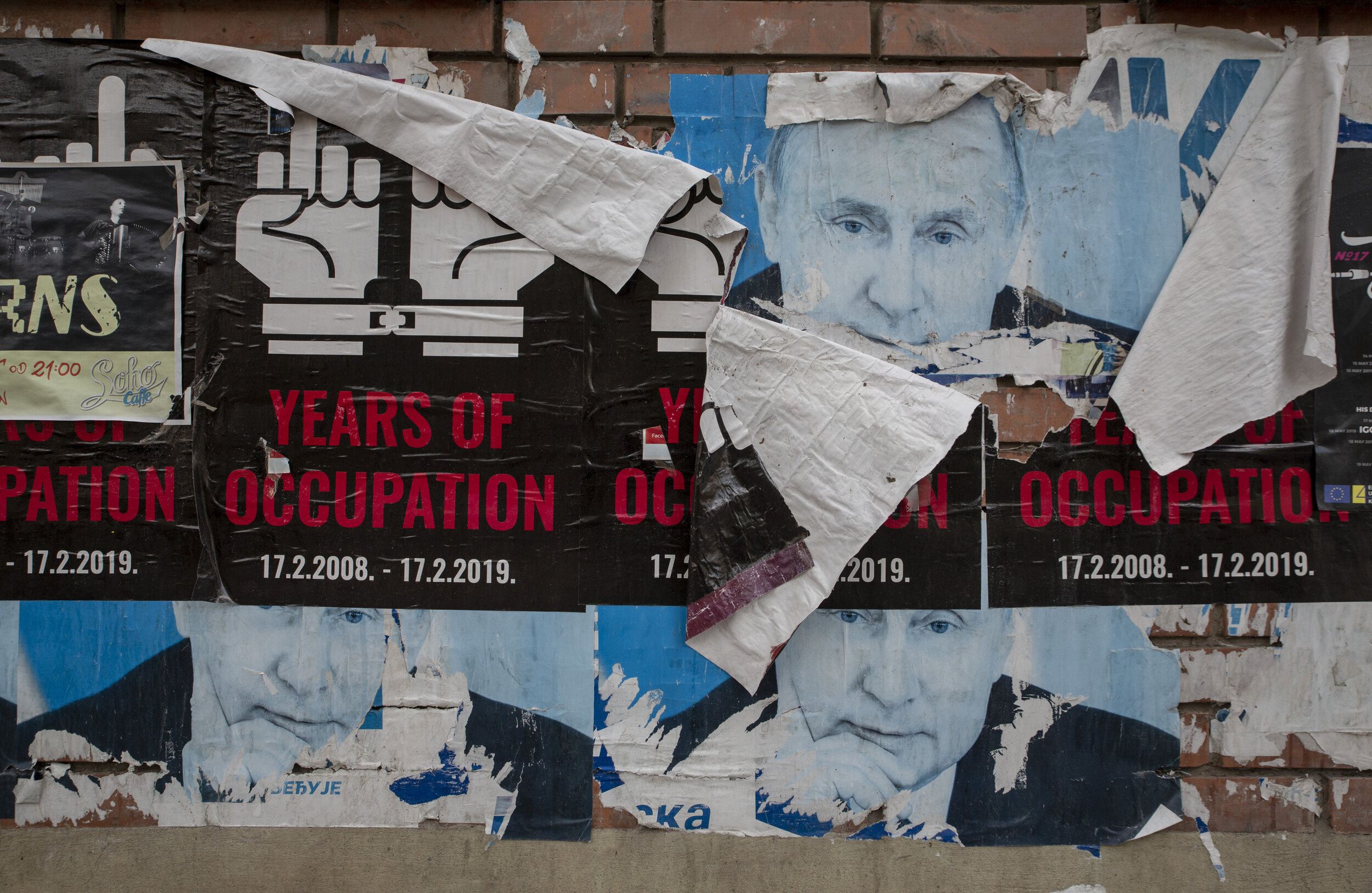  Political posters are a common sight in Mitrovica, like these claiming the occupation of Serbia since Kosovo declared independence on Feb. 17, 2008 plastered over images of Vladimir Putin. 