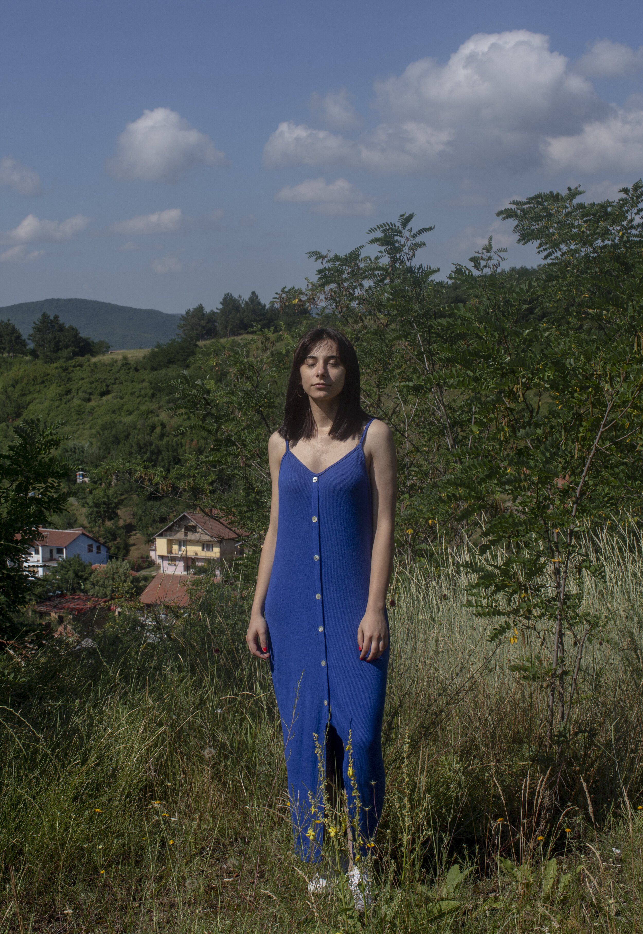  Ilda Krama, 19, stands above the neighborhood in north Mitrovica where her mother lived before she was expelled during the war. Ilda's mother is Albanian and her father is Bosnian, so she was raised speaking both languages in south Mitrovica. When s