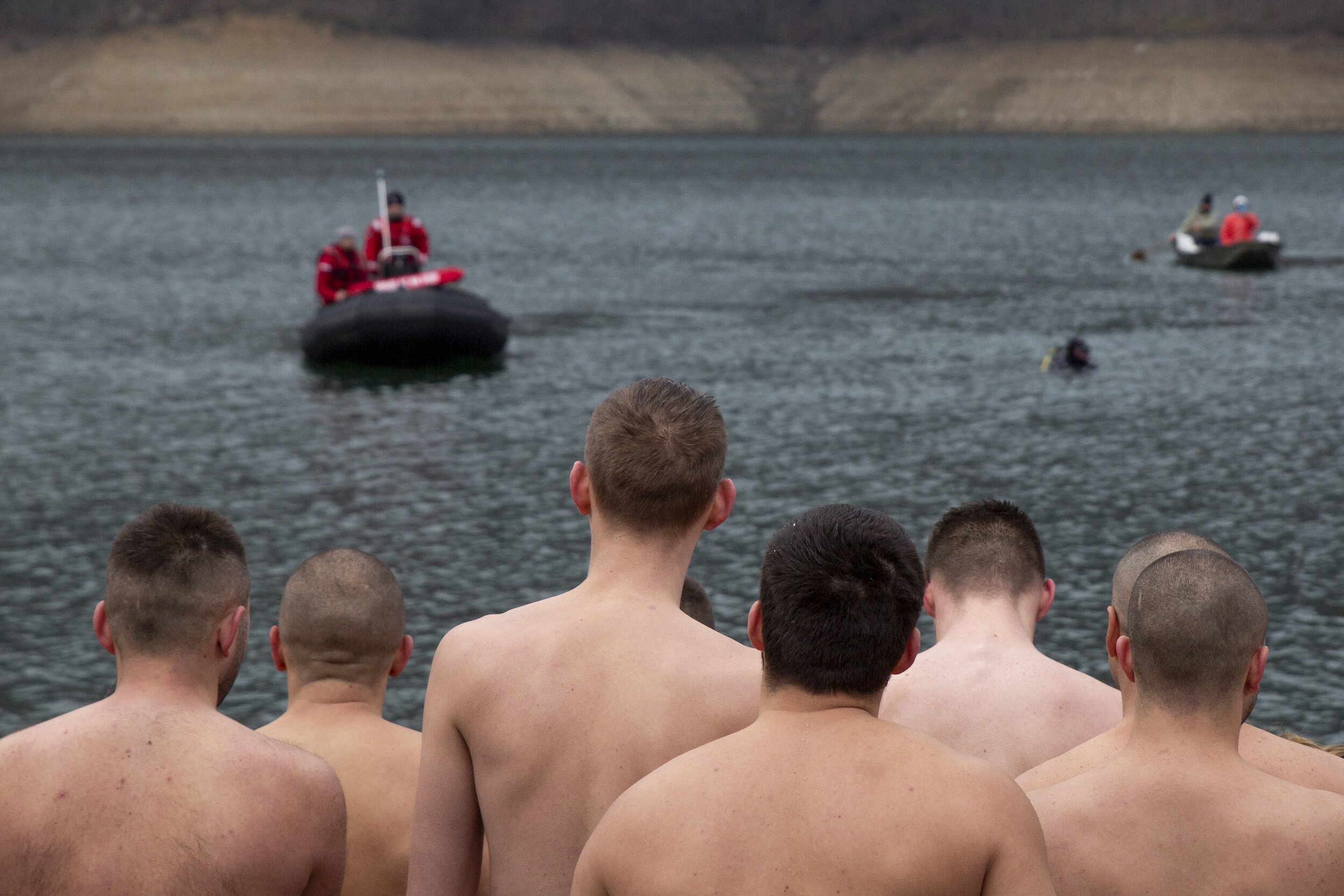  Men and boys from the Serb-majority municipalities of North Kosovo gather along the shore of Gazivoda Lake in Zubin Potok, a village near Mitrovica, before participating in Epiphany cross diving. Beyond being a significant religious event, this is a