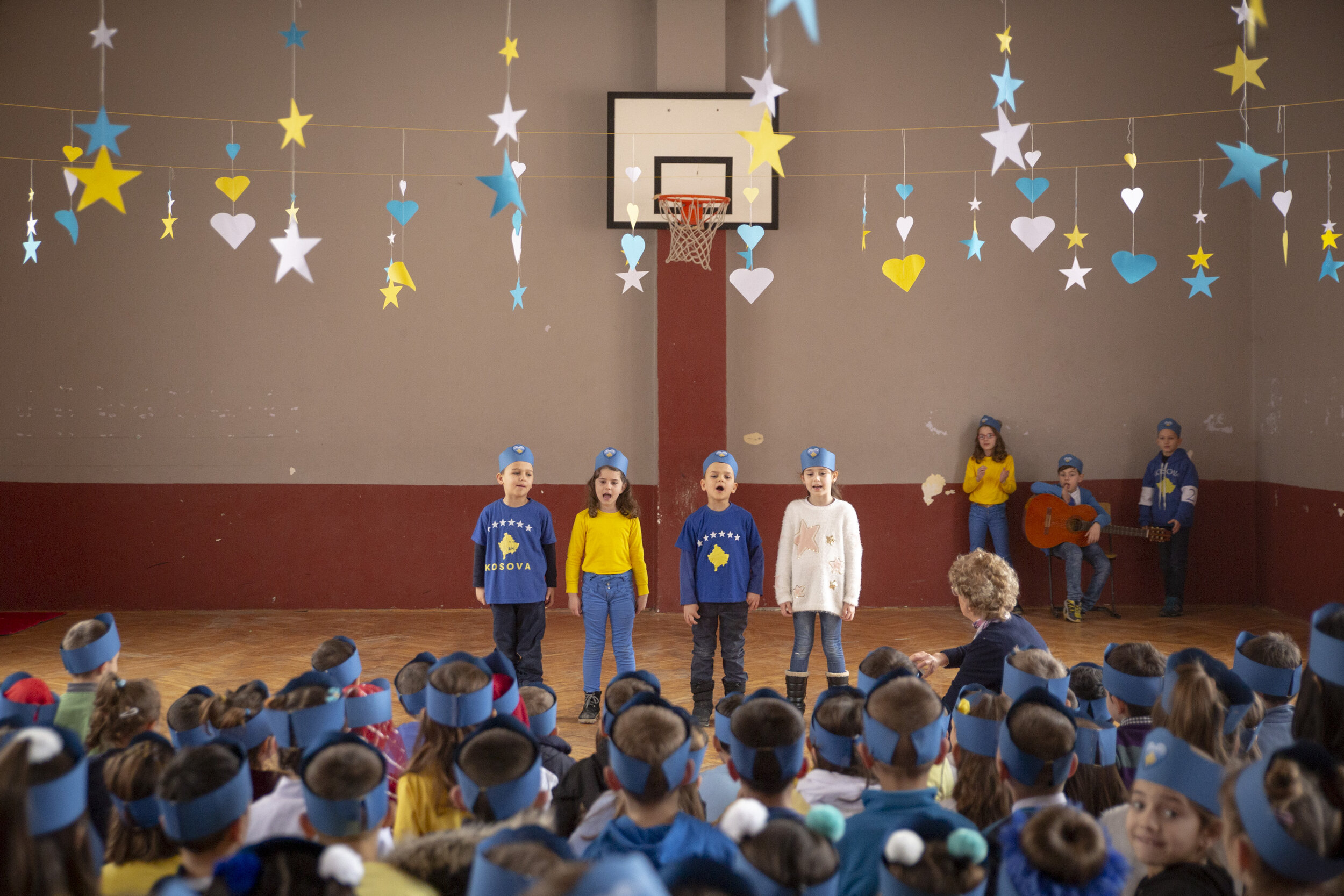  Dressed in yellow and blue, the colors of the Kosovo flag, children celebrate Kosovo Independence Day at Bedri Gjinaj primary school on the south side of Mitrovica. Kosovo declared independence on Feb. 17, 2008. 