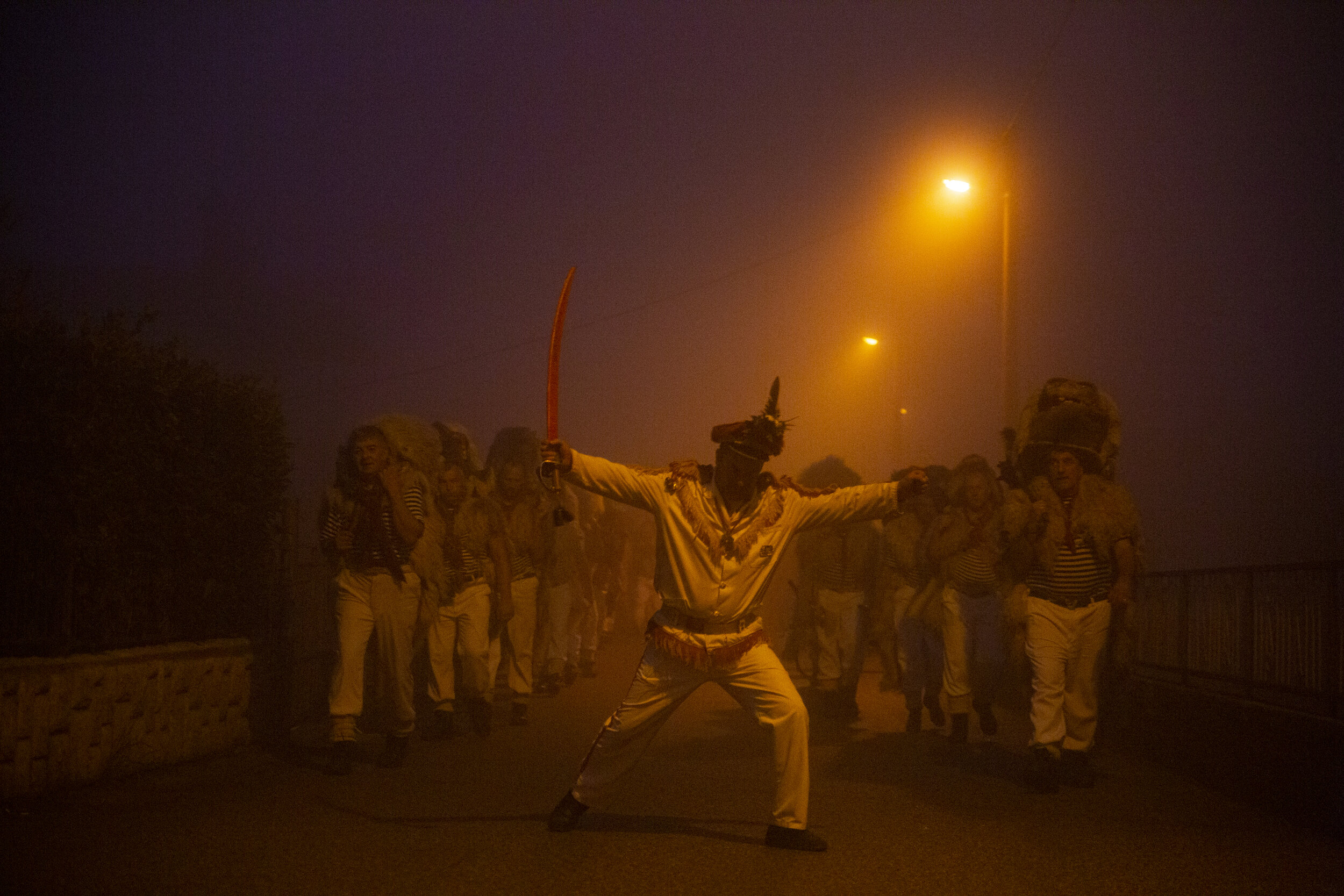  In the final stretch of their three-day tour of the region, Halubajski zvončari walk through a deep fog to the village of Viskovo, where they will burn an Effigy representing evil from the last year in order to move into a new year. This is known as