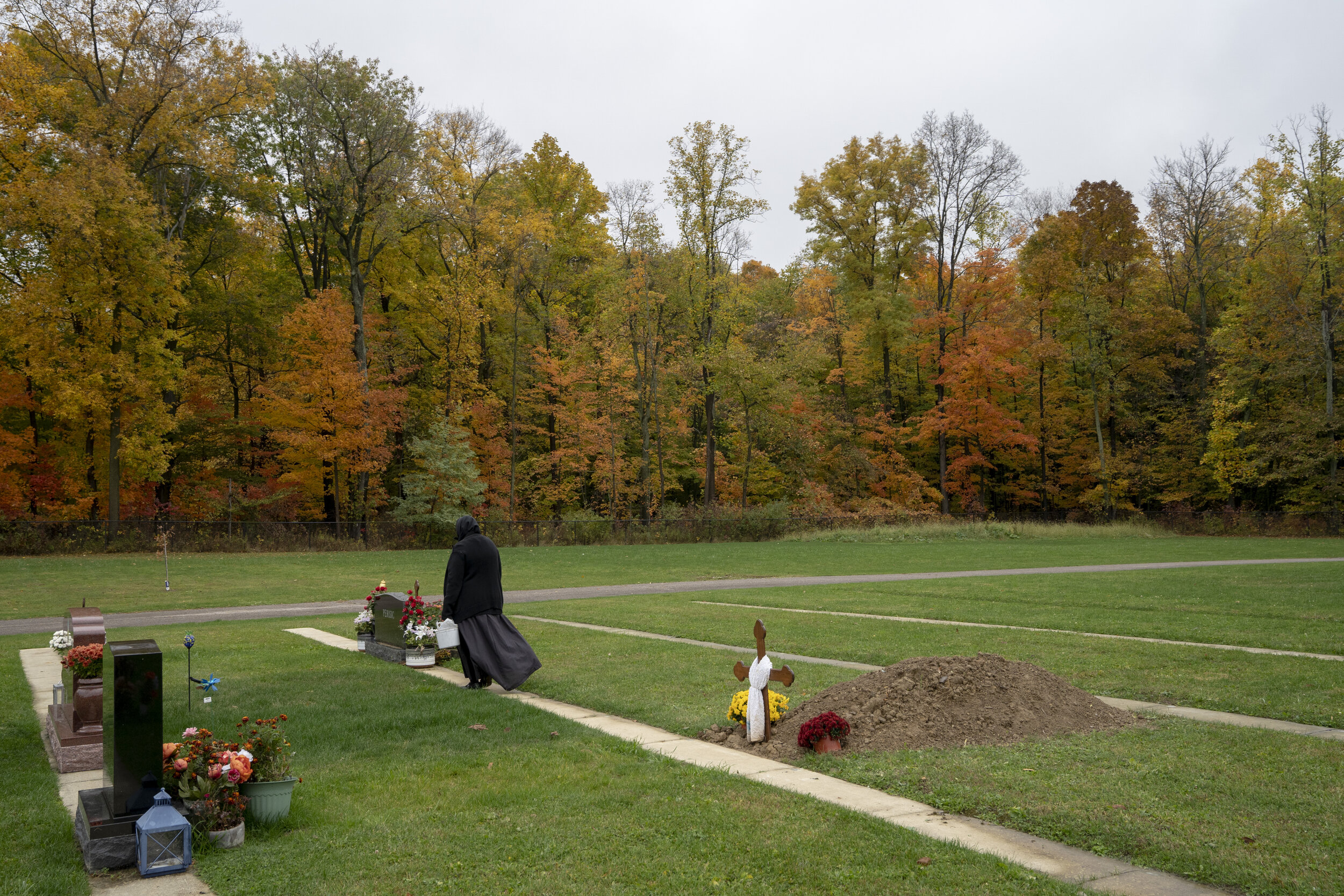  Sister Anastasia, 75, tends to the graves at Marcha Monastery, a Serbian Orthodox women’s monastery in Richfield, Ohio, where she is the only remaining nun, Oct. 20, 2020.  