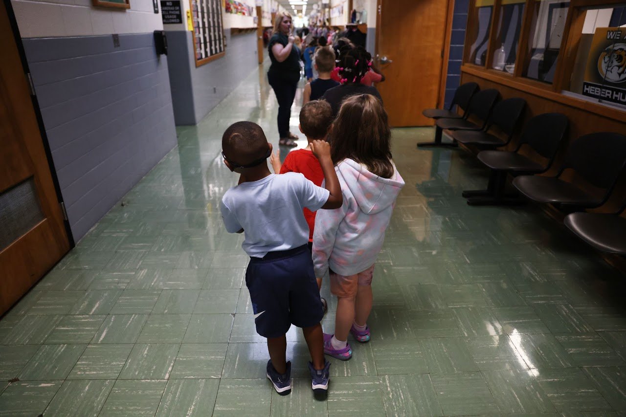  Carter is told to get back in line by his kindergarten teacher, Ashlea Snapp, at Heber Hunt Elementary School. “For kids like him who need more emotional support, changes are really hard,” said Ashlea. 