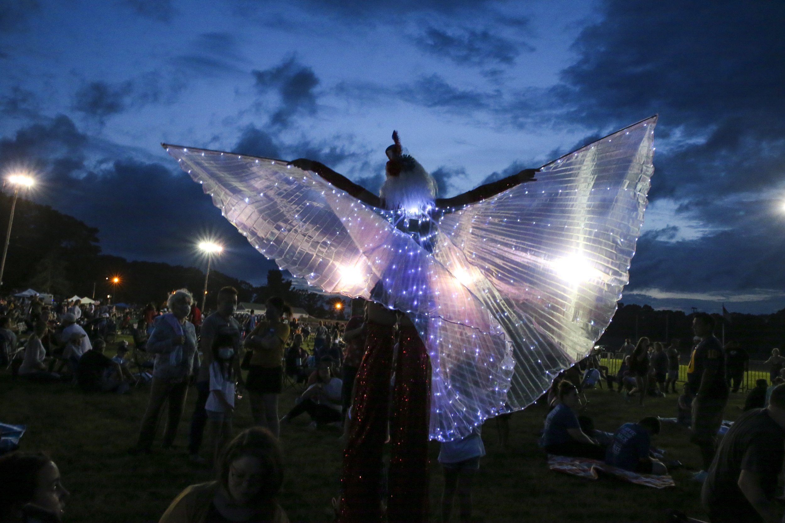  Boston Circus Guild member Liz Knights walked on stilts at the Braintree Fourth of July celebration in Braintree, Mass. on June 27, 2021. 