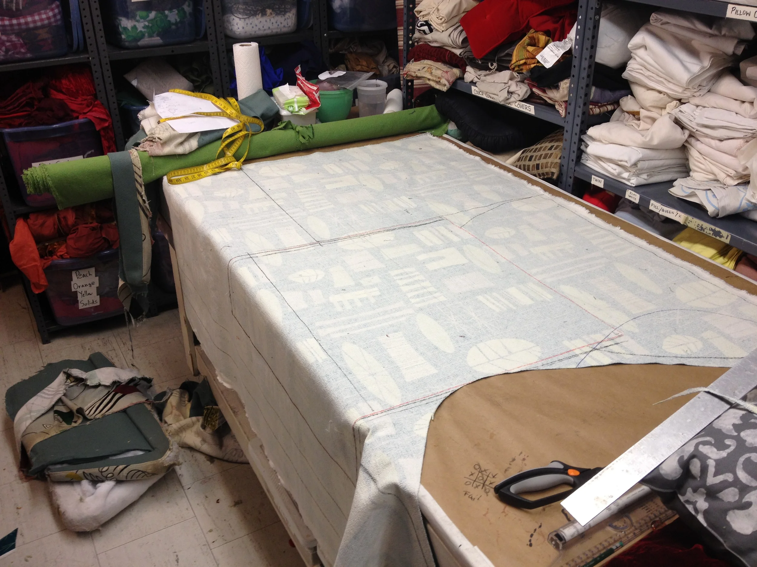  Laying out the fabric trying to figure out the best way graphicaly&nbsp;for the pattern to appear on the chair . 