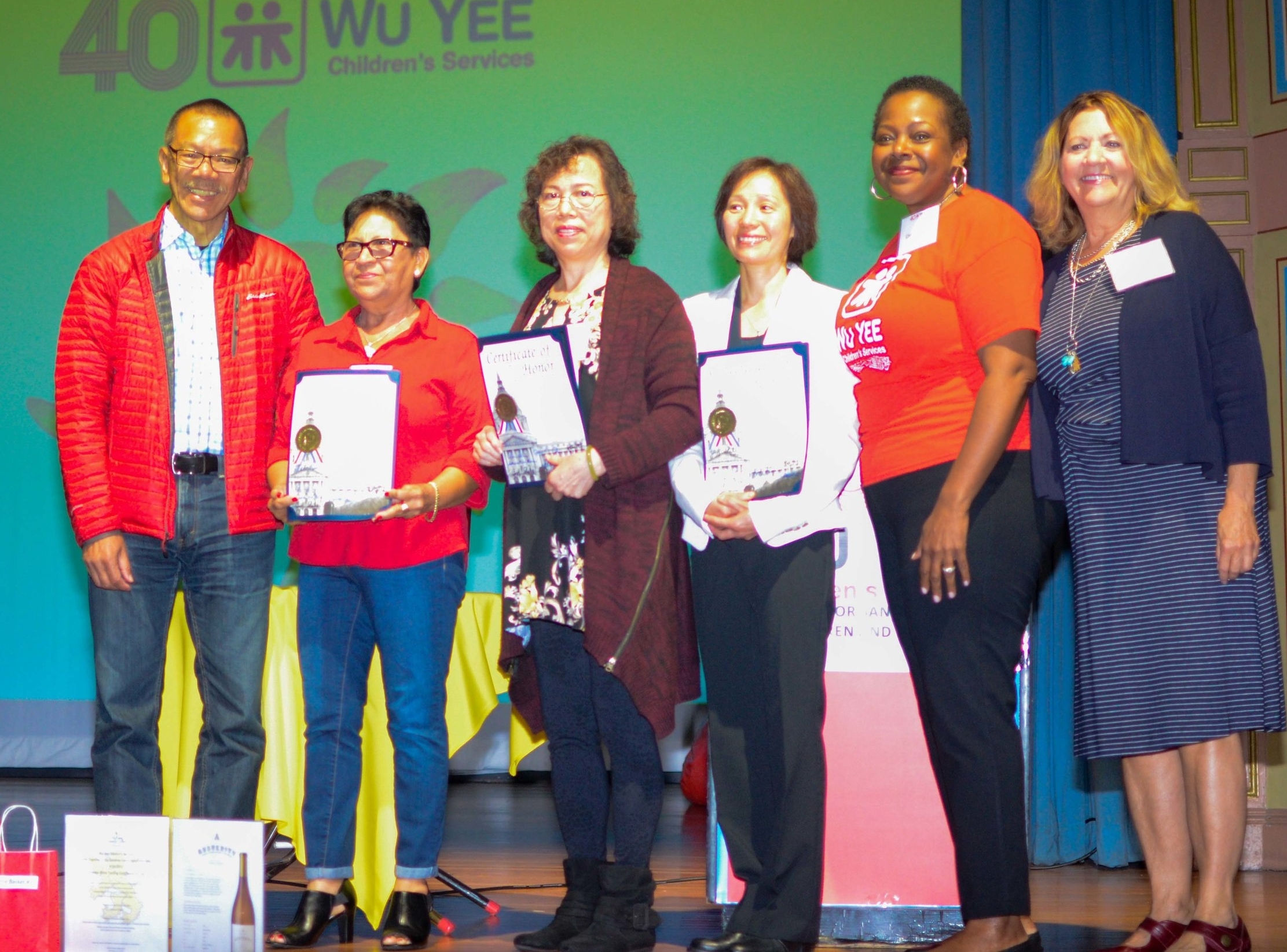 Supervisor Norman Yee with Awardees Delia Suarez, Siu Kam Cheung, and Barbara Ng, Director of Provider Services, Cheryl Hughes and Chief Executive Officer, Monica Waters. 