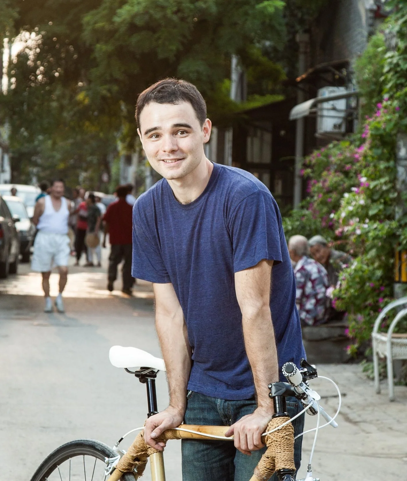 David Wang, the founder and instructor of Bamboo Bicycle Beijing, poses for the photograph in an alleyway of Hutong, a traditional residential area in Beijing, China.