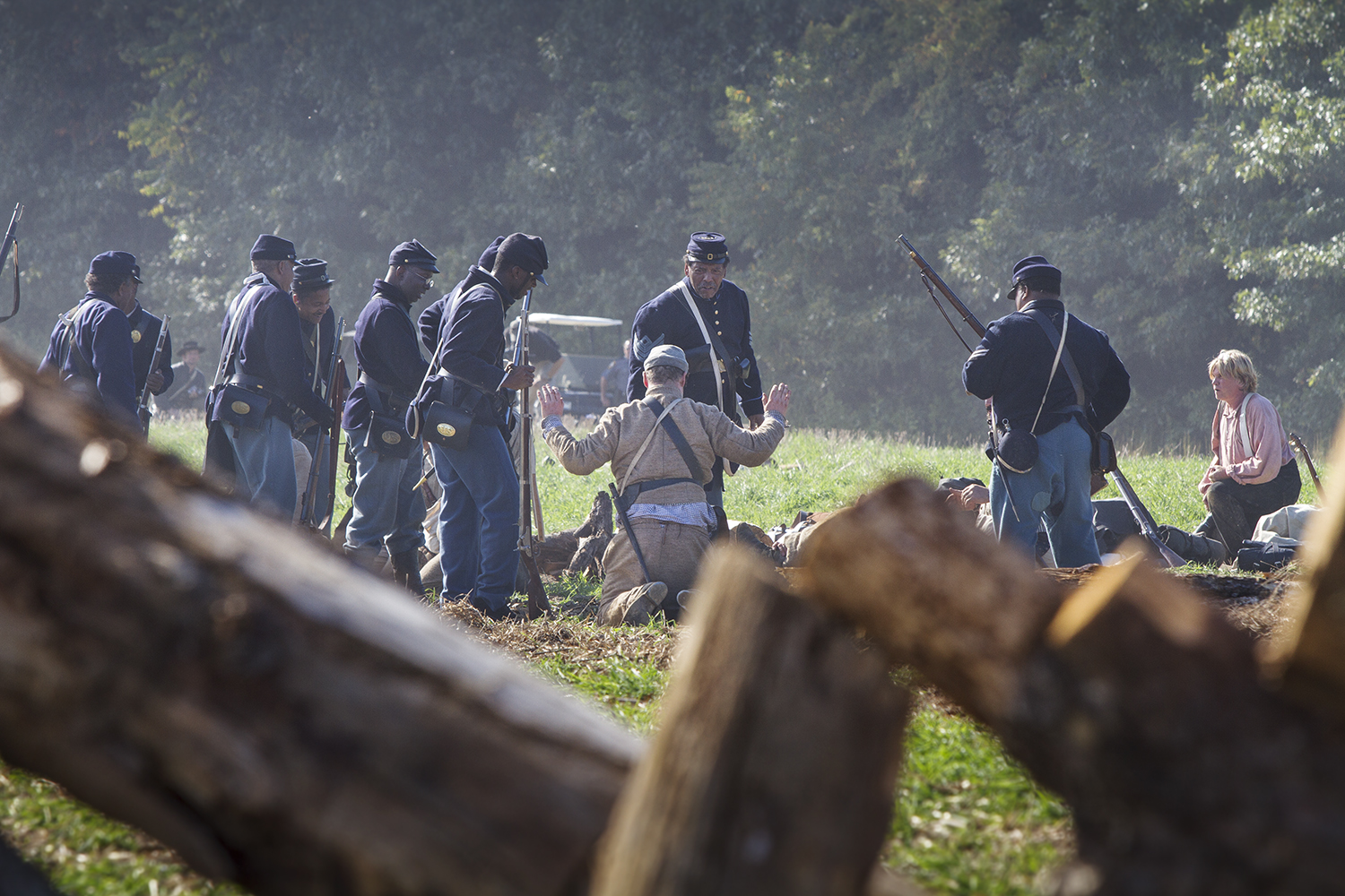  Soldiers of the United States Colored Troops take a Confederate prisoner during a reenactment of the battle of New Market Heights. Henrico, Co., Virginia, September 2014 