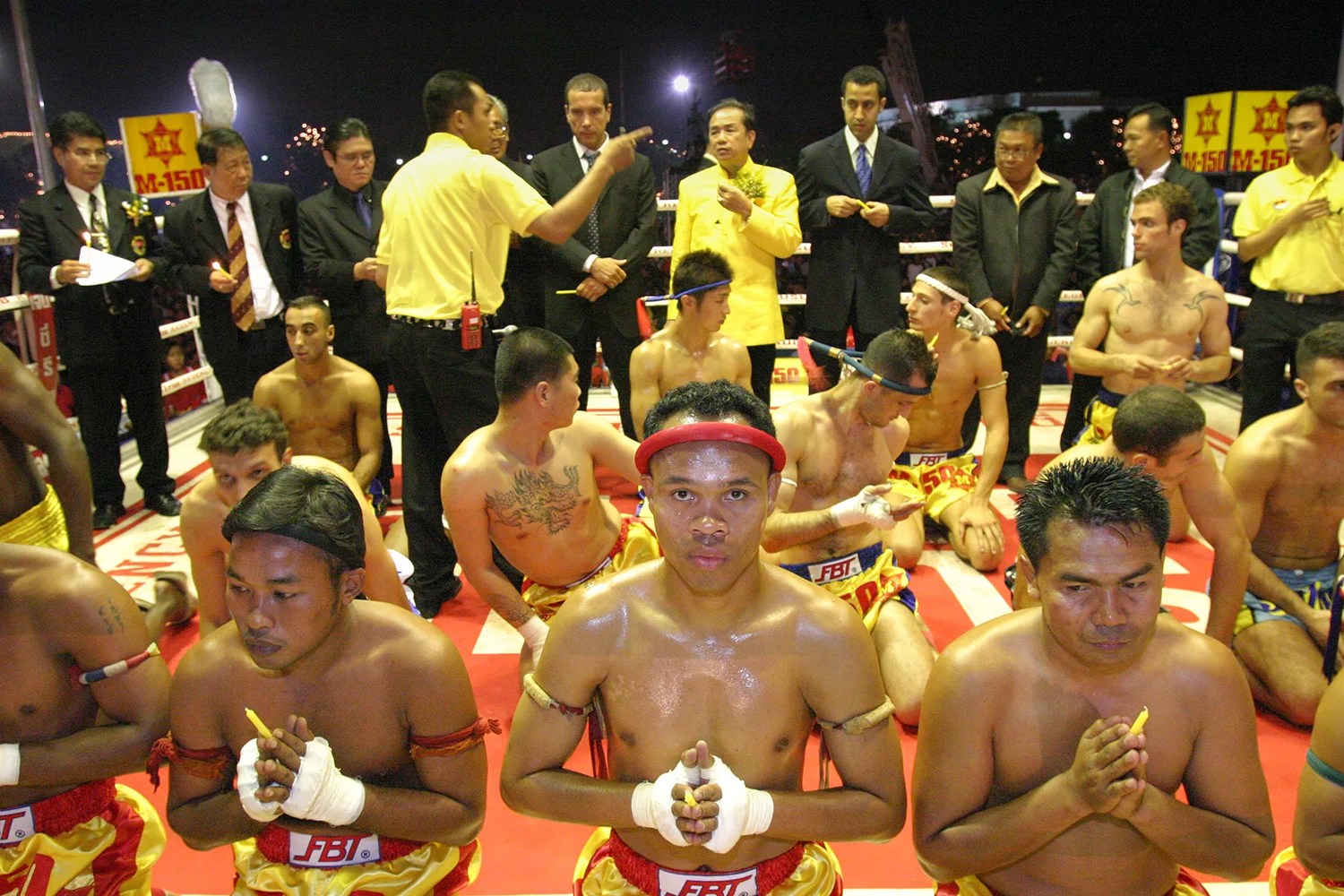 Muay Thai fighters during ceremony before the King's Cup, held to honor King Bhumibol Adulyadej on his birthday, at Sanam Luang Park, Bangkok, Thailand, 2003