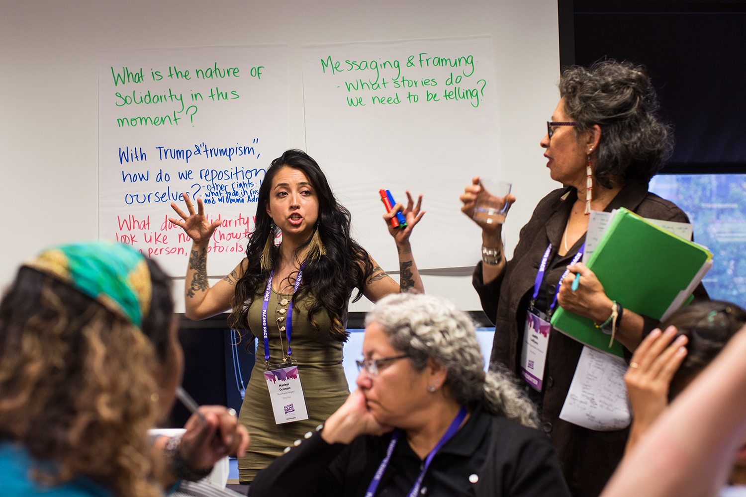  The  Praxis Project 's Marisol Ocampo speaks and take notes for the group during "Solidarity with Standing Rock" breakout session during Facing Race 2016, Atlanta, GA, 11 November 