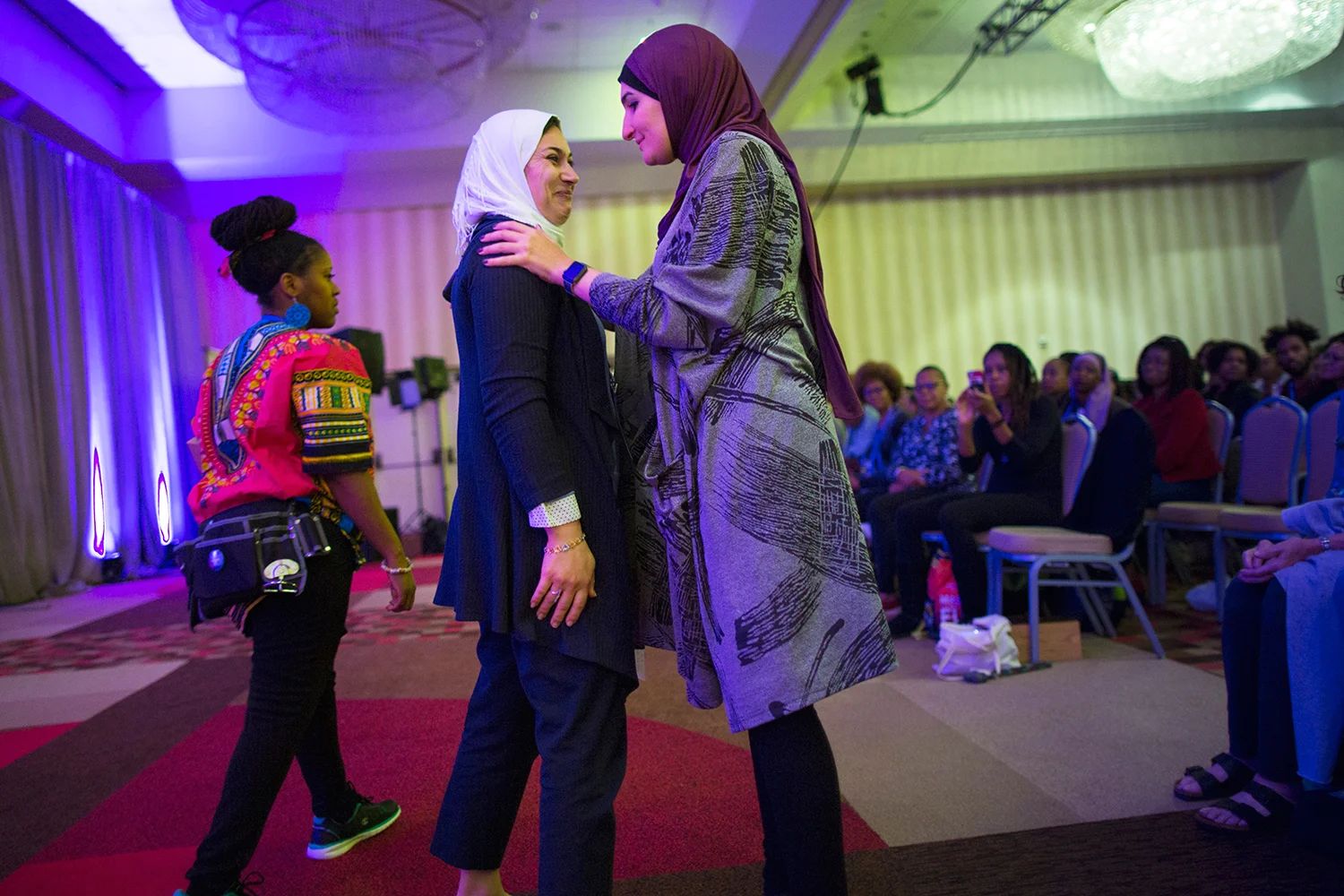 Linda Sarsour ( Arab American Association of New York ) speaks to Dr. Enas Alsharea after the doctor addressed attendees of Facing Race 2016, Atlanta, GA, 12 November