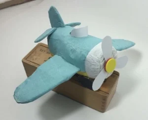 "Paper" Plane. Surprise Ball made by Etsy NY Team member Watermelon Party Shop.