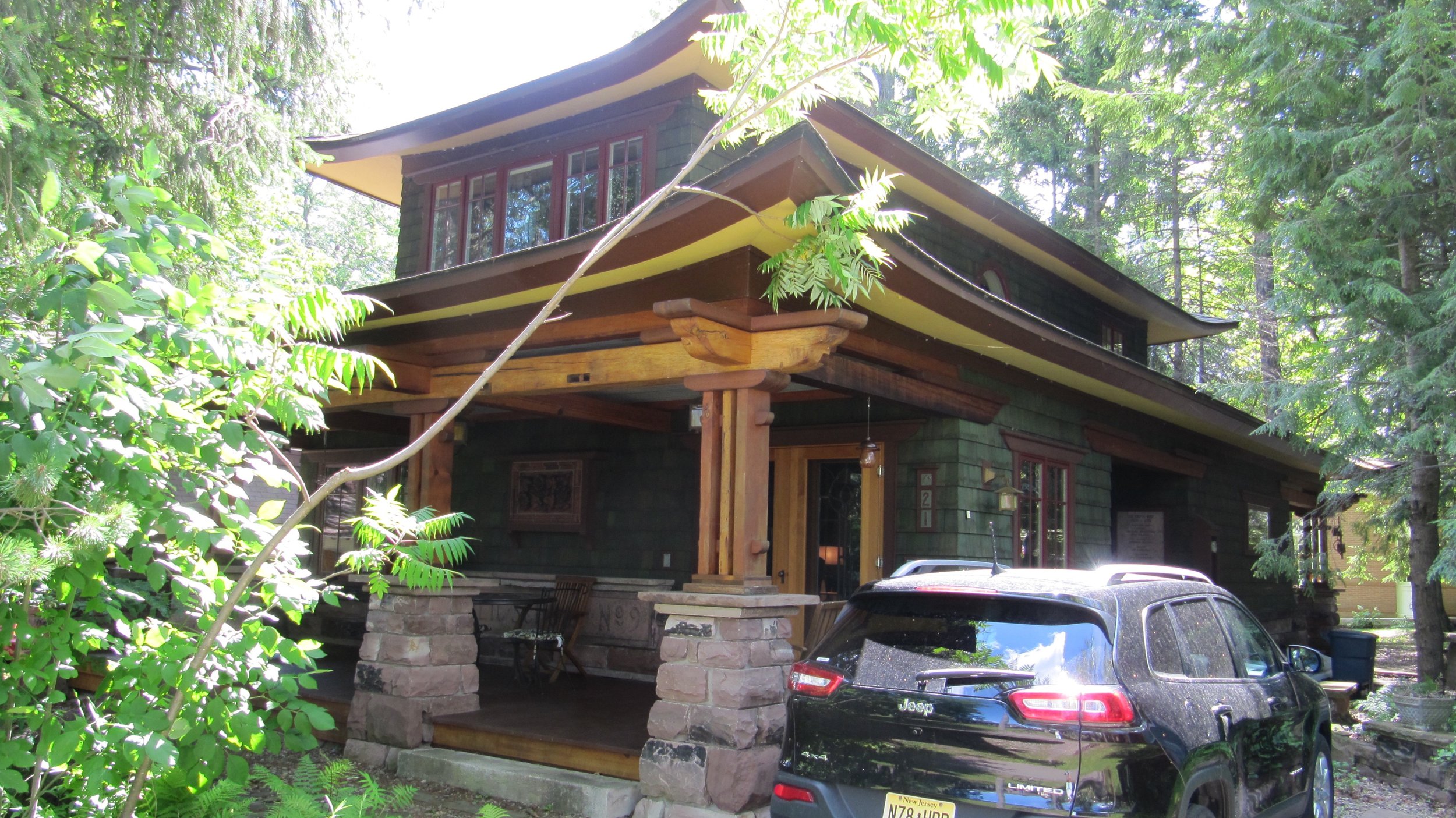 This asian inspired craftsman bungalow was built with reused materials, including blocks from a former public school. Fittingly, it faces the Institution's children's school, where elementary age vacationers can go to morning camp.