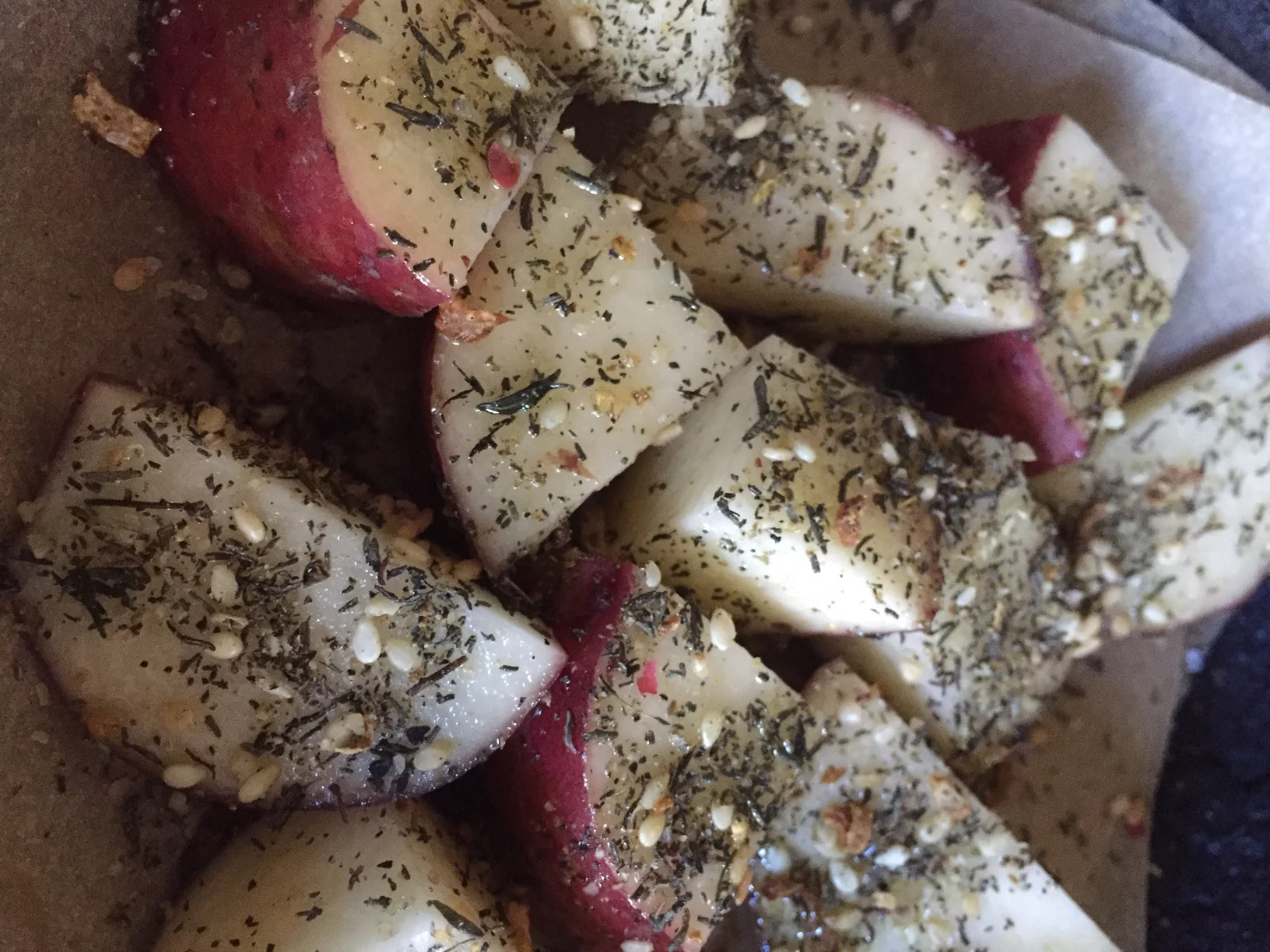 Recipe Preheat oven to 425 degrees Recipe: for about 4 servings Cut 4 potatoes into bite size pieces and par boil about 10 minutes 2 tablespoons dried thyme 2 tablespoons dried lemon peel - replaces Sumac whichI didn’t have 2 tablespoons sesame seeds, toasted Course salt to taste Grind together in food processor or spice grinder Place par boiled potatoes on parchment paper - I love using this whenever possible saves a lot on clean up! sprinkle oil on potatoes and toss Sprinkle with Zatar mixture Roast for 35 minutes.. If inclined drizzle sesame tahini on top and serve