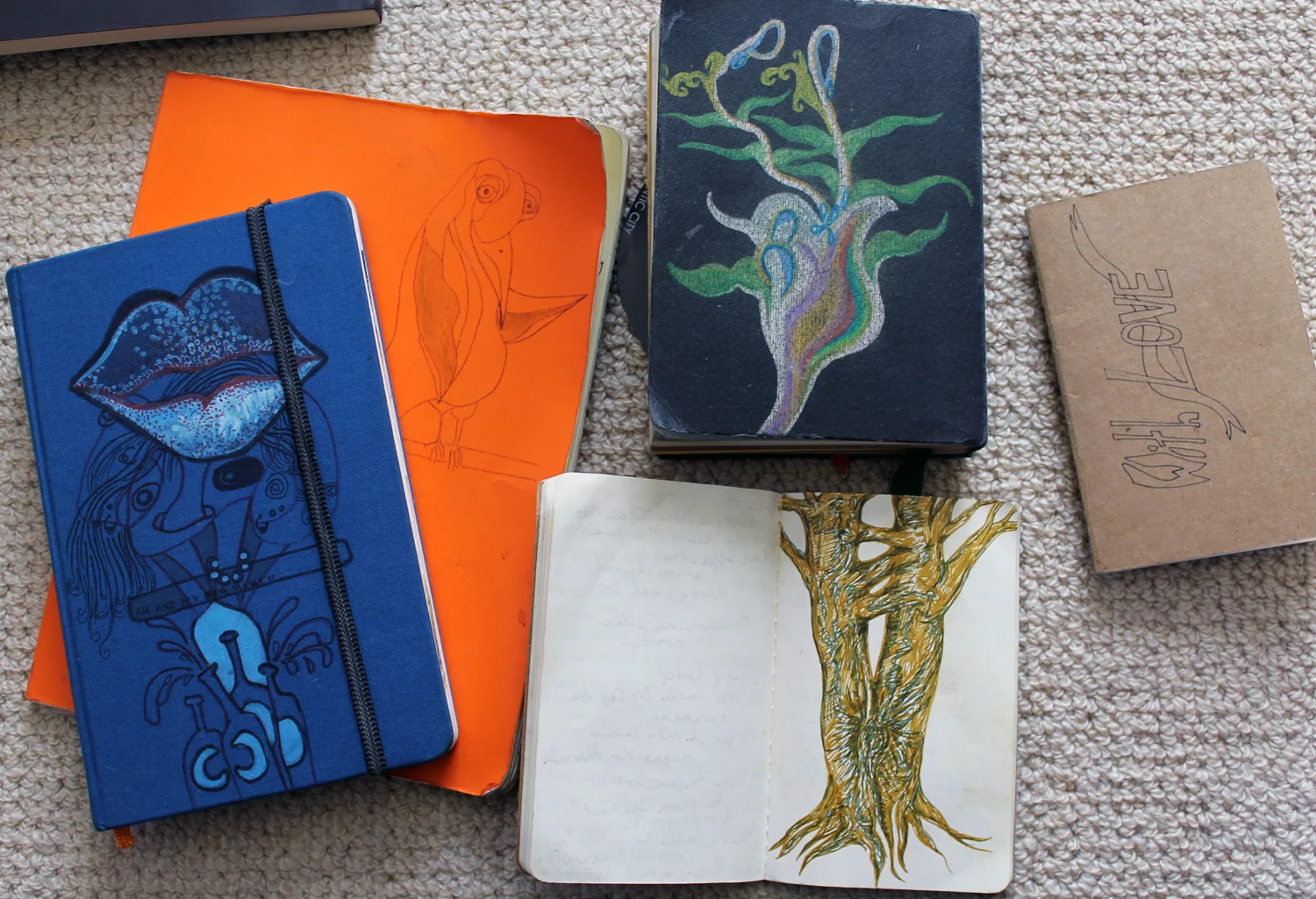  small smattering of sketchbooks. some of many... an ever growing collection of my brain's ramblings, musings, characters, color relations, experiences on paper... some of my most prized possessions. 