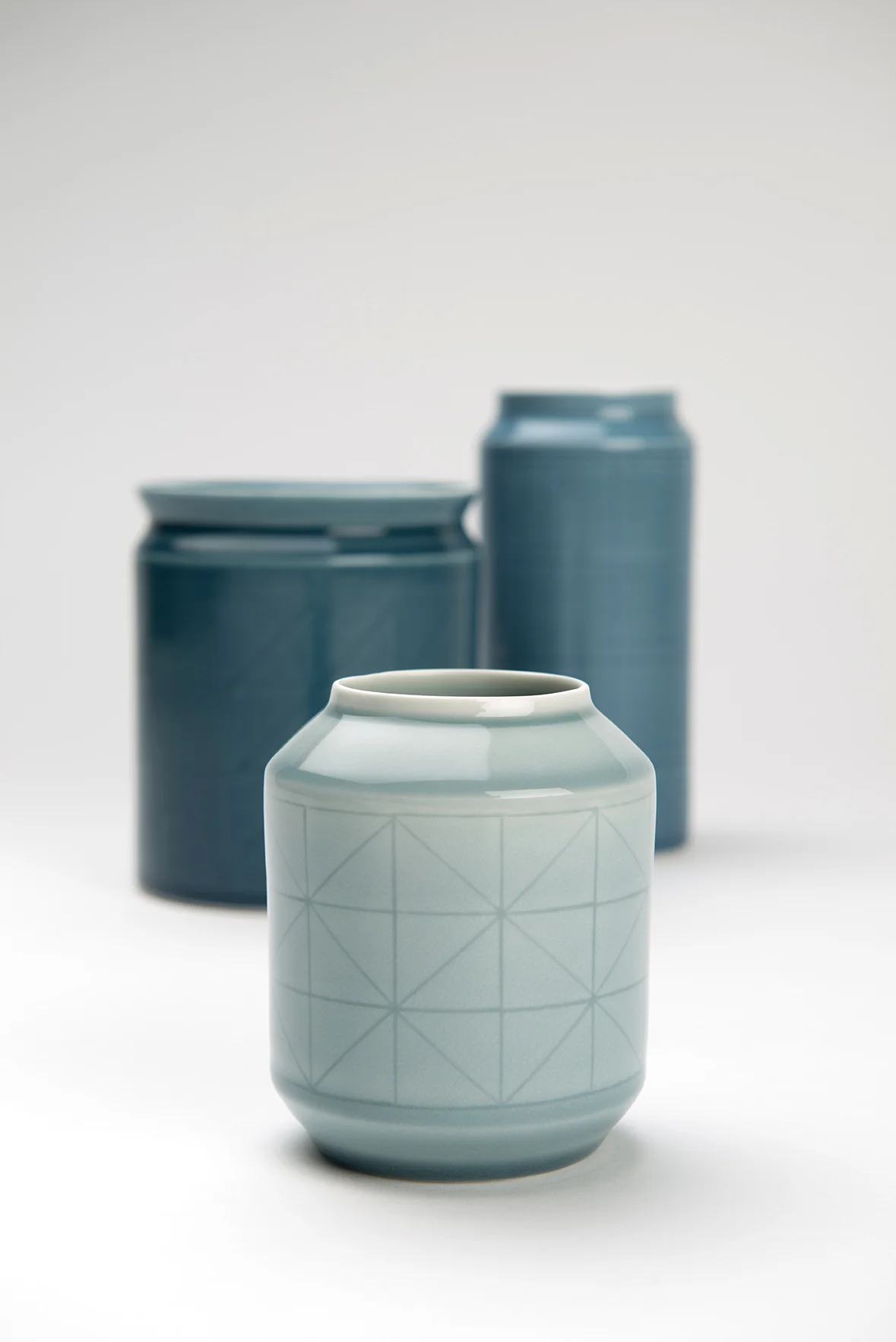 Porcelain vessels, wheel thrown, carved and relief detail