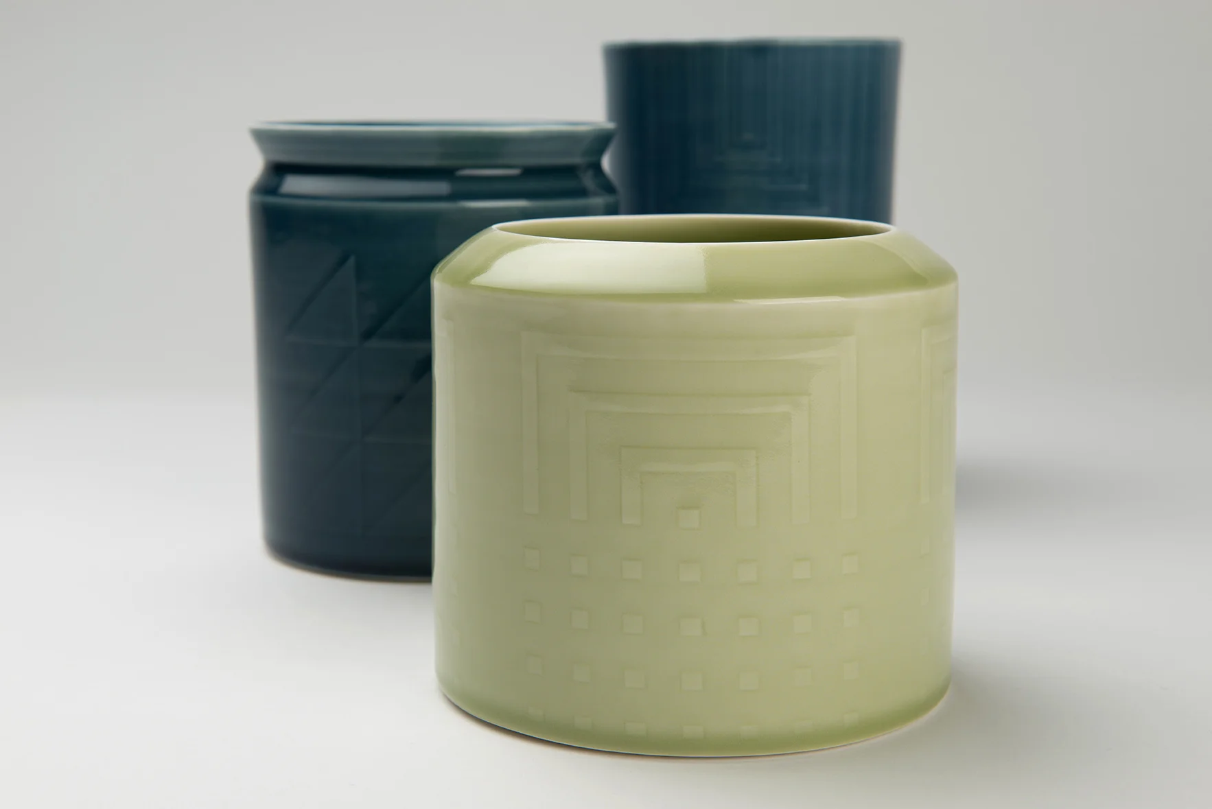 Porcelain vessels, wheel thrown, relief detail Front 13 x 14 cm Middle 15 x 13 cm Back 18.5 x 12 cm