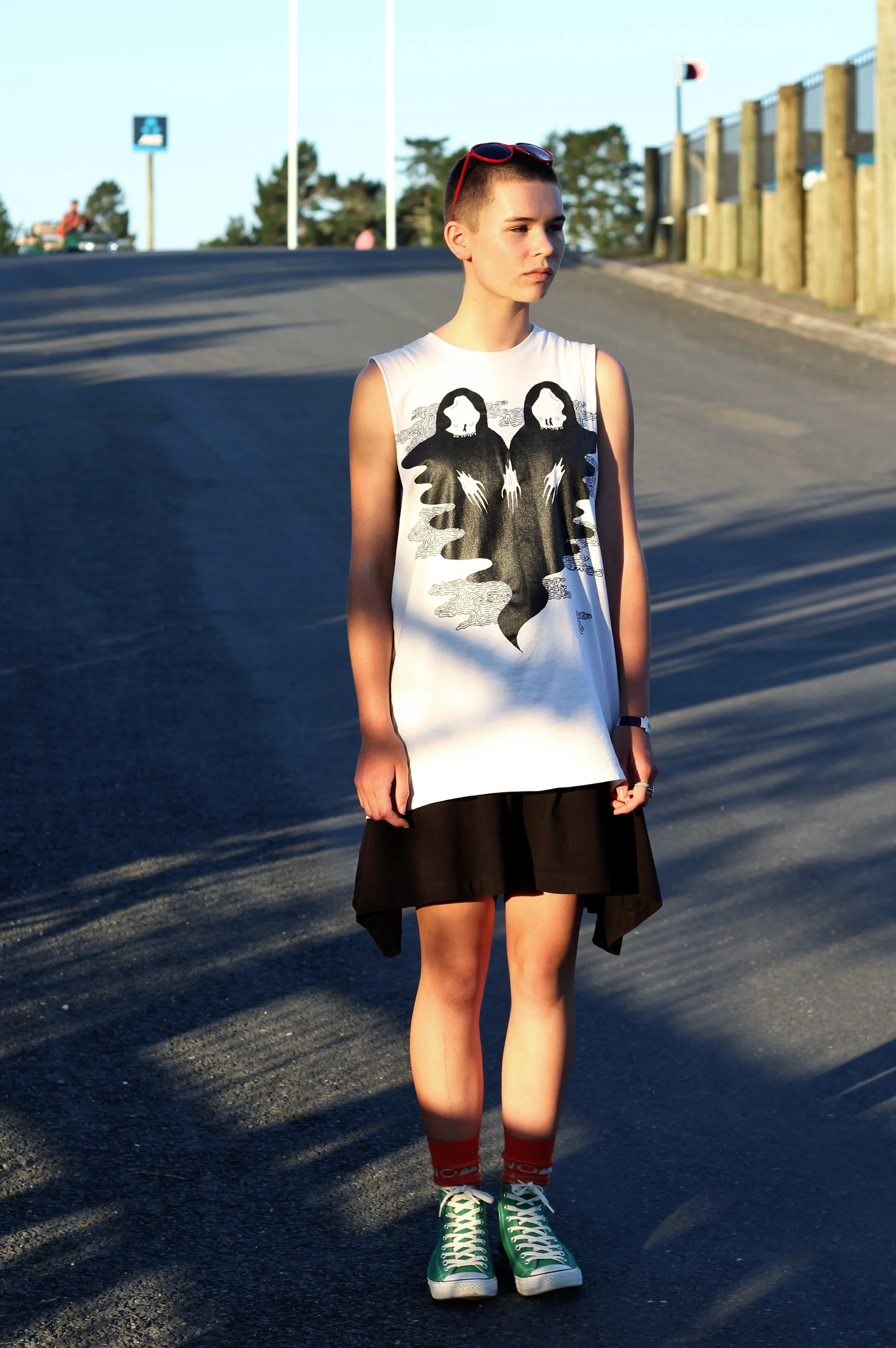 Me looking not very happy (cos the sun was in my eyes) I'm lucky enough to be wearing a Zac Fay tee from Strange Love with Kowtow Shorts, Nom*D socks and my beloved converse, plus heart shaped sunnies from a $2 dollar shop. 