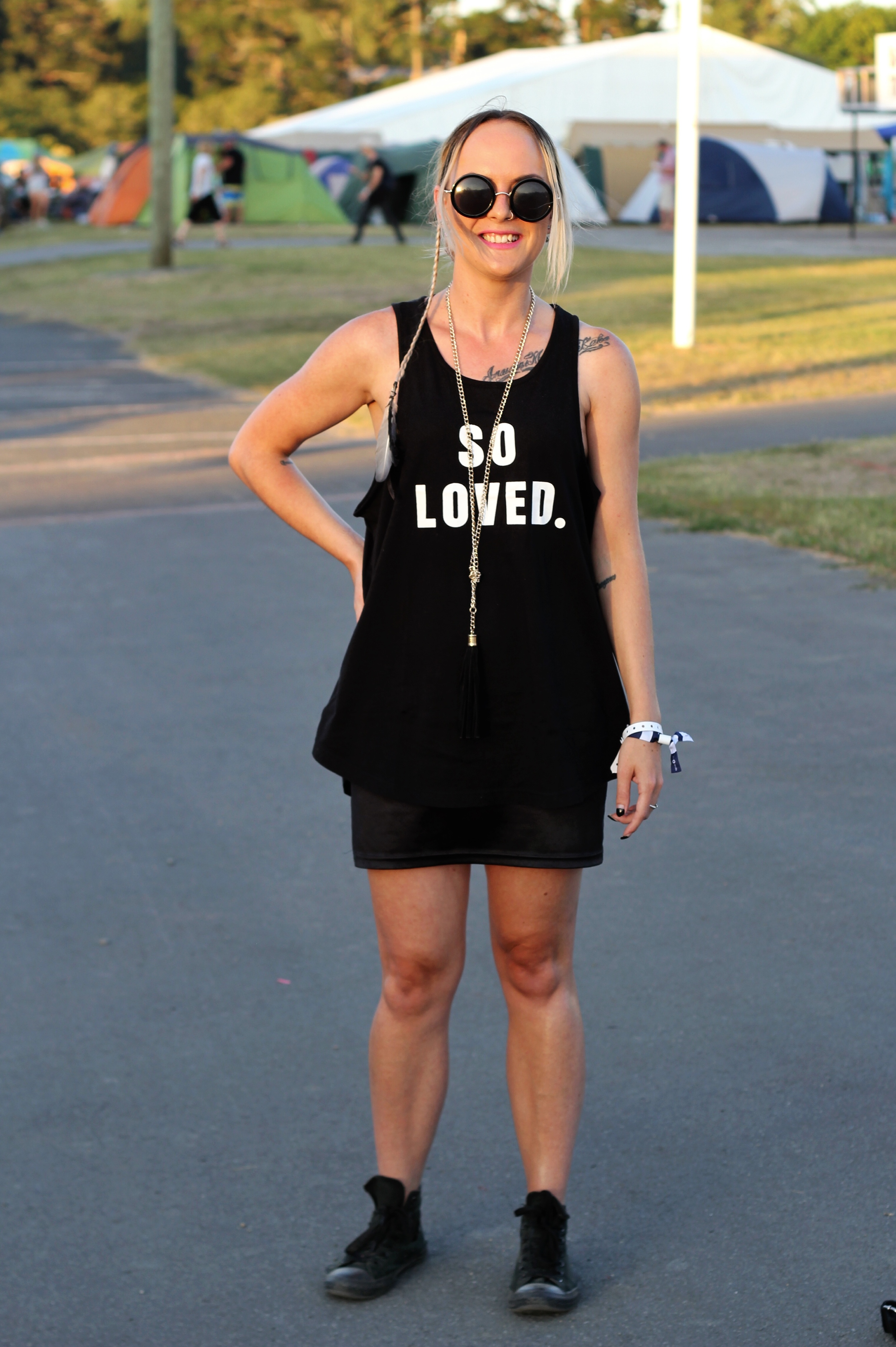 Deleesha Cains wearing a Hillsong, the colour sisterhood tee , an Opshop dress, Chuck Taylors and a necklace she made herself.