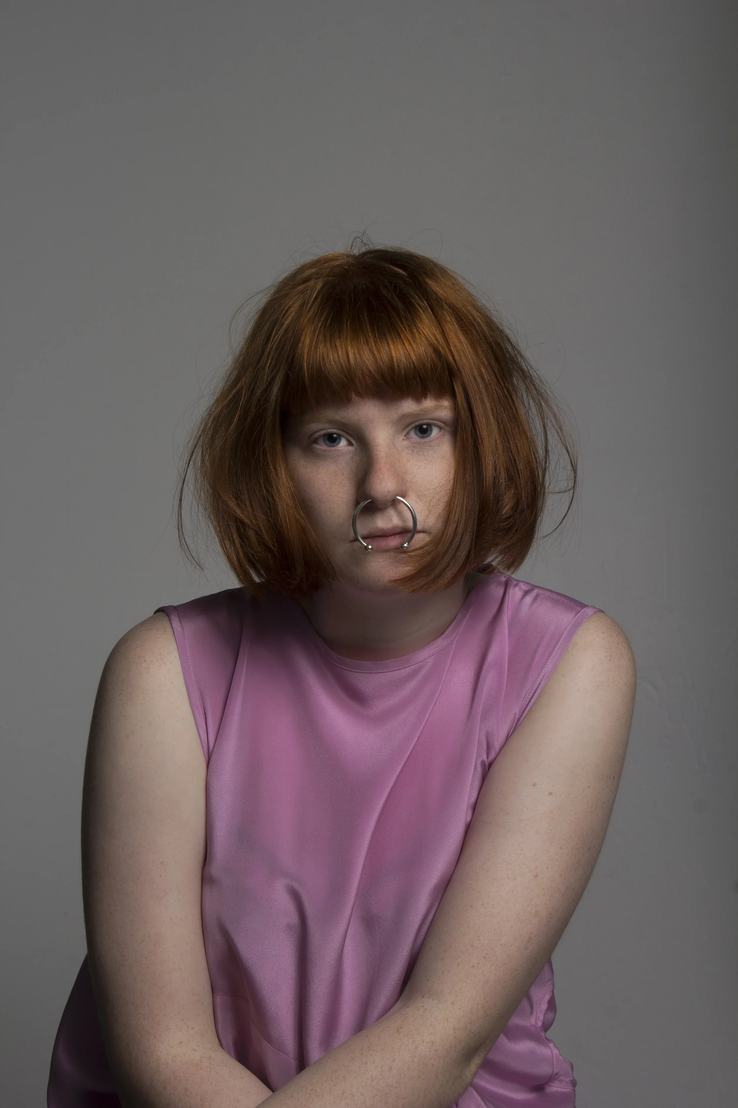 A Jarrad Godman Dress with a Meadowlark Tubular hoop earring
