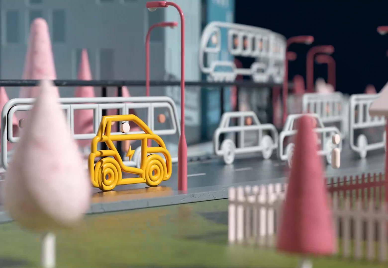 Colorful miniatures of city buses and traffic cones on a model city street with pink and yellow traffic cones and a yellow bus figure.