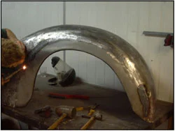 A London Taxi has a new edge panel welded into place with the Oxy and acetylene welder.