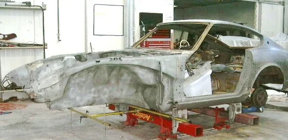 The Datsun 240Z was stripped down by the customer before it delivery to the workshop. The Datsun had accident damage to the radiator support panel and the inner tower. The Inner skirt also needed work to align. The body shell was setup on the chassis measuring equipment.