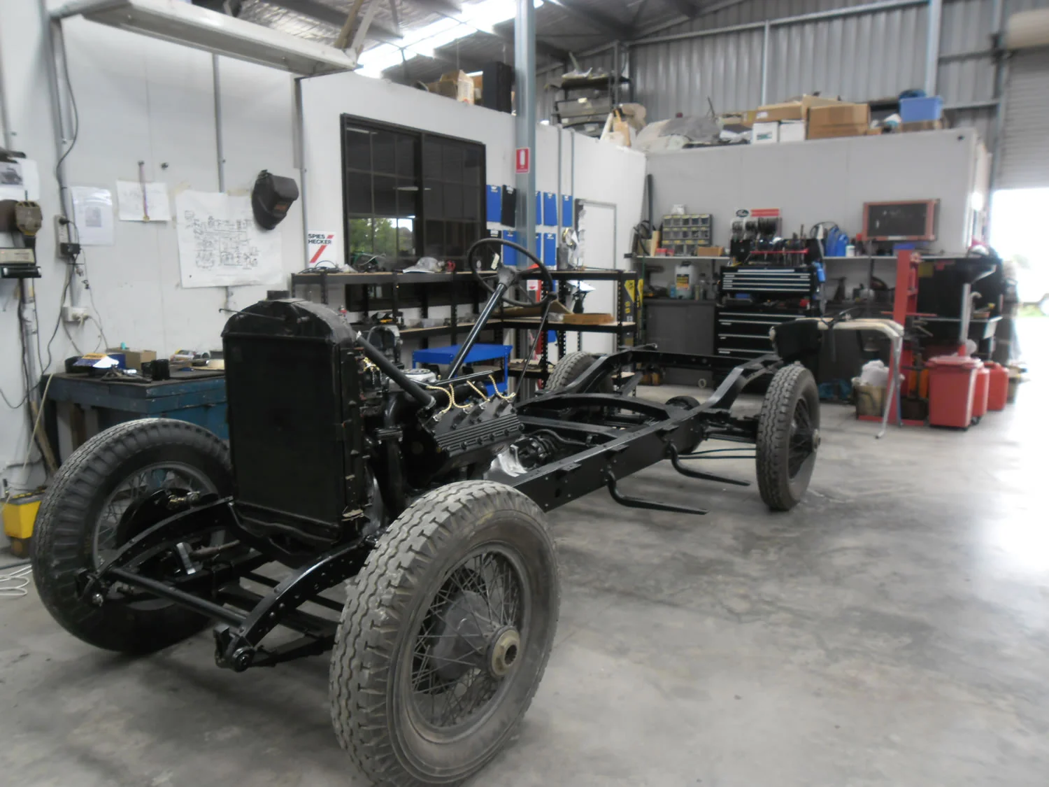 The chassis has been checked over and sandblasted. The chassis was painted with semi gloss chassis black. The engine was stripped down and checked over . Rusted engine parts were cleaned along with swarf and loose nuts found in the engine. The crank and big end bearings were checked over. The engine was reassembled and was painted black. The distributor has been covered to a modern type from a Holden V8. The brake drums were machined and set. New brake linings were rivet to the original shoe irons. The gear box and differential was overhauled.