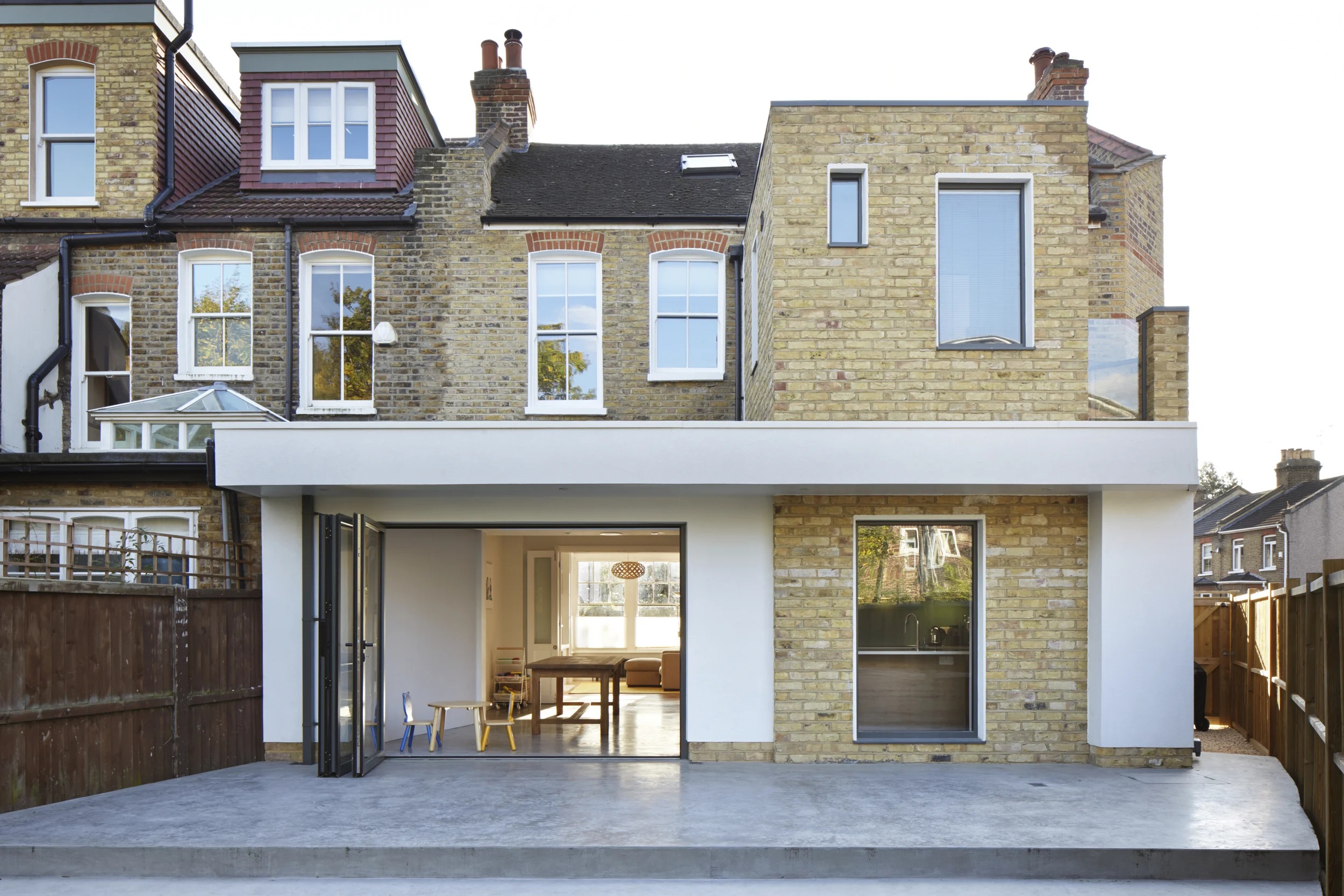 This project was a complete transformation from two very tired old flats into this stunning four bed family home.  It had a top to bottom refurbishment and a double back extension with polished concrete floor and under floor heating.&nbsp; We also i