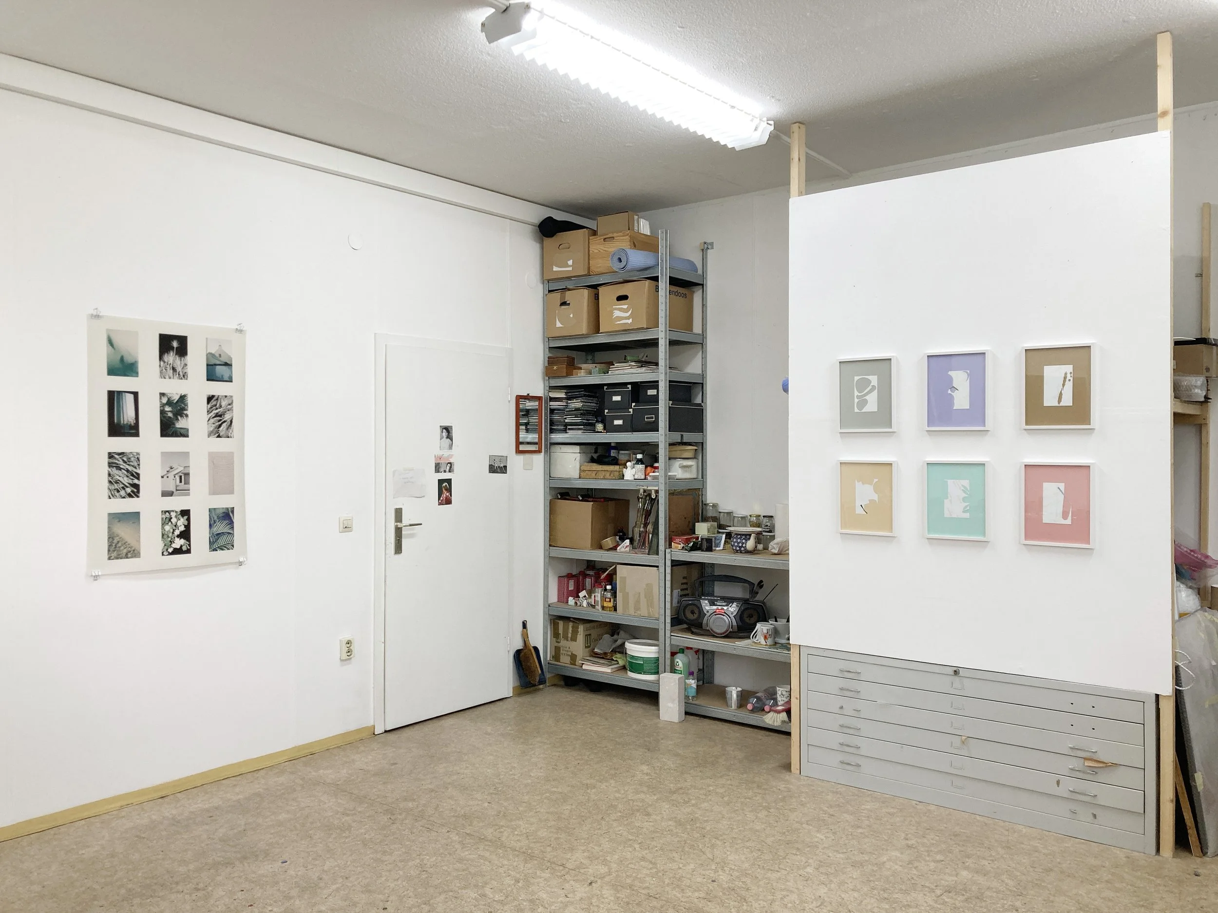  Installation view in studio: Das Jahr der Hoffnung und der Leichtigkeit 1, 2022, inkjet print on newspaper, 105 x 70 cm  Das Jahr der Hoffnung und der Leichtigkeit 2, 2022, cut up photographs on coloured paper, six frames, 40 x 30 cm each  