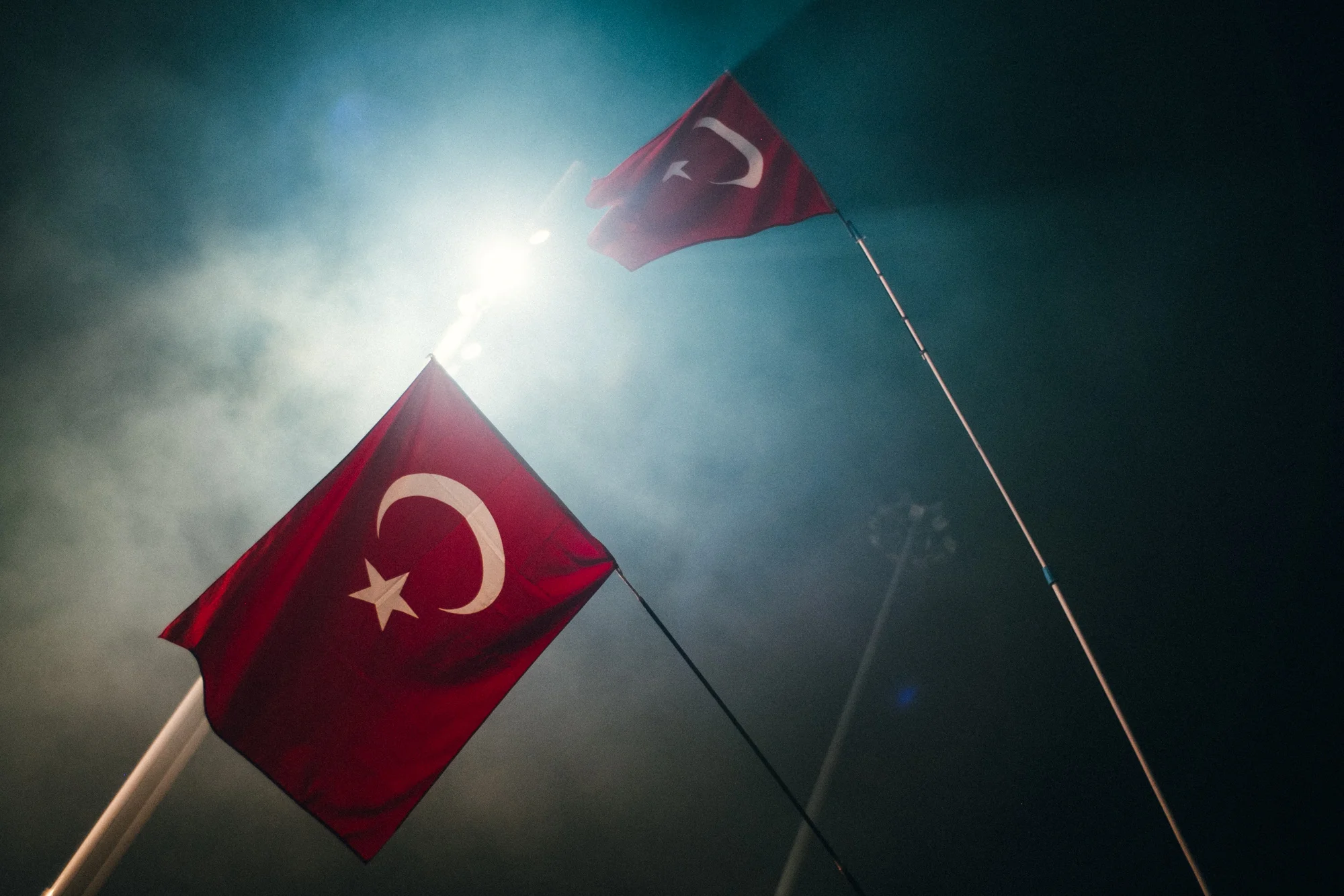 July 29, 2016 - Istanbul, Turkey. Two Turkish flags held aloft during a rally in Taksim Square following the failed putsch. 