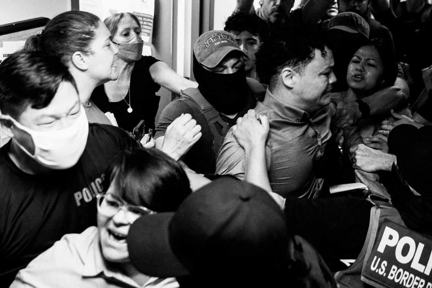  Federal agents seize a man, center, after his immigration hearing in which he was granted a subsequent hearing in four years in the Jacob K Javits Federal Building in New York on 16 July 2025.  Julius Constantine Motal/ The Guardian  
