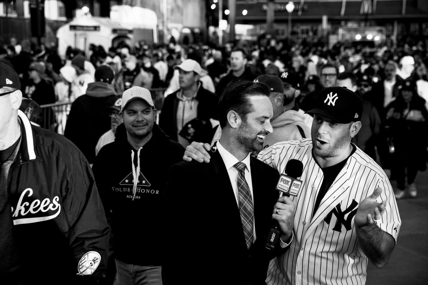  A Yankees fan talks with a sports broadcaster about the team's chances in Game 3 the World Series against the Dogers outside Yankee Stadium in the Bronx, New York, on October 28, 2024.   Julius Constantine Motal/ The Guardian  