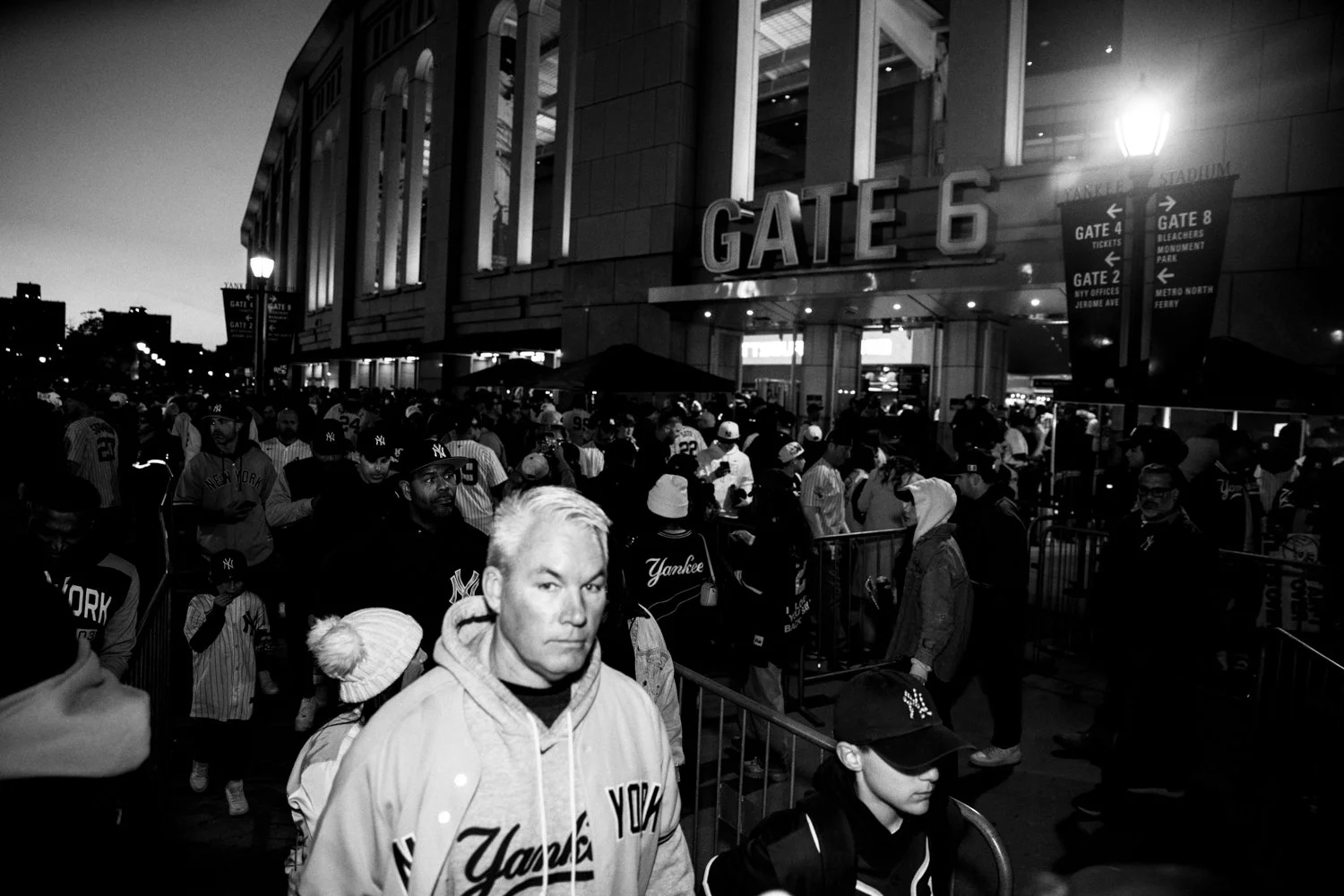  Yankees and Dogers fans wait in line to enter Yankee Stadium in the Bronx, New York, on 28 October 2024.  Julius Constantine Motal/ The Guardian  