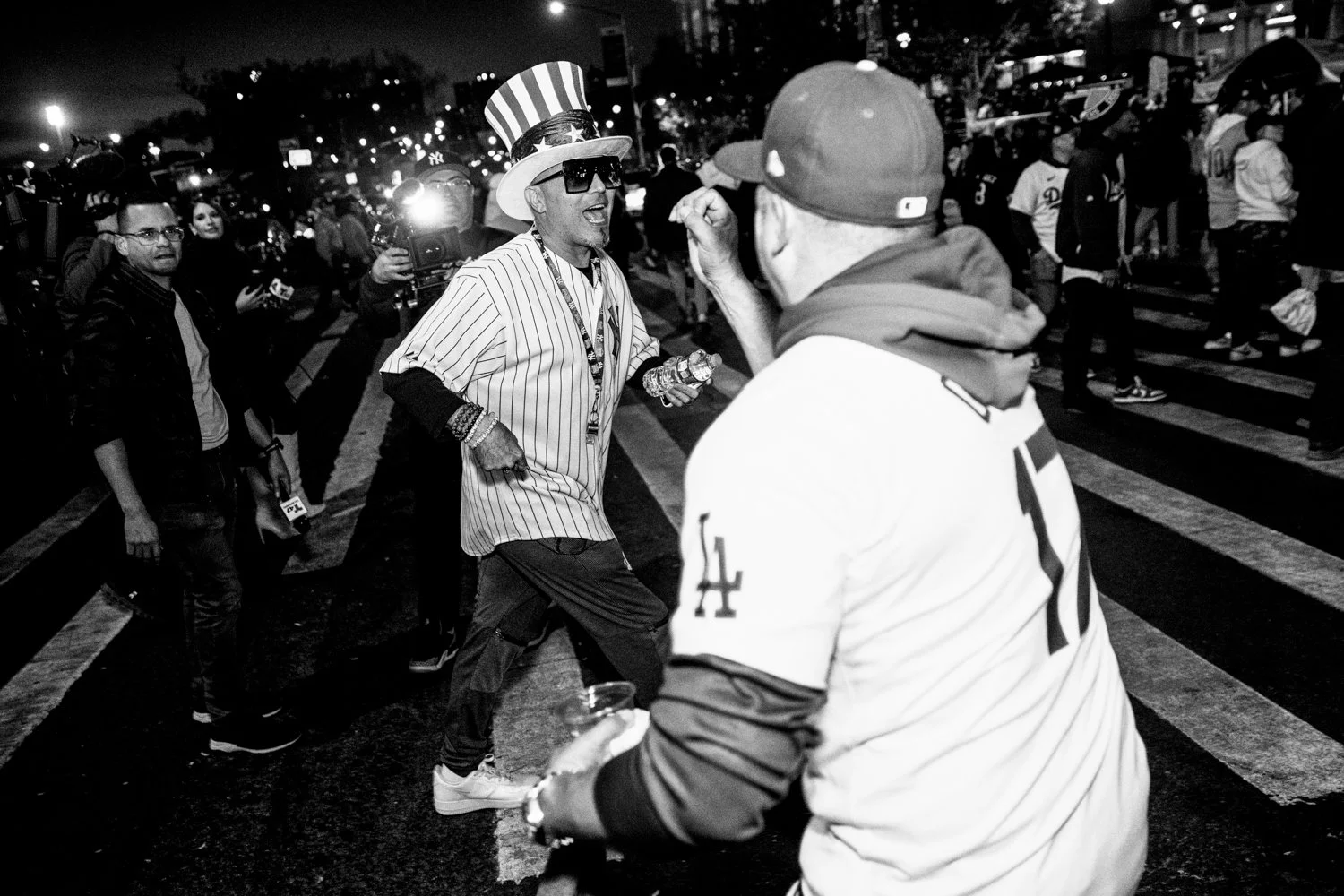  A Yankees fan and a Dodgers fan shout at each other near Yankee Stadium ahead of Game 3 of the World Series in the Bronx, New York, on October 28, 2024.  Julius Constantine Motal/ The Guardian  