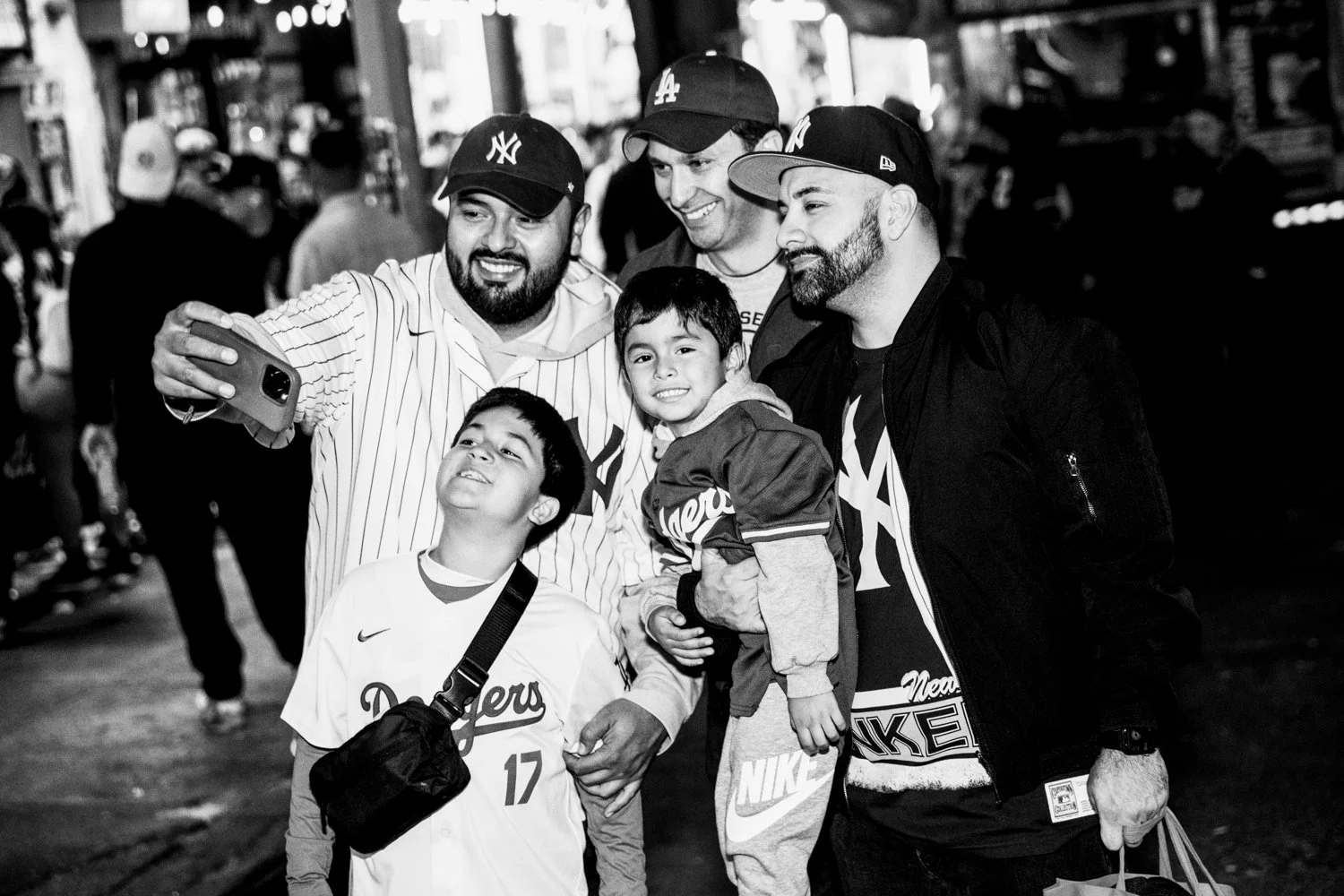  Yankees and Dogers fans take a selfie near Yankee Stadium ahead of Game 3 of the World Series in the Bronx, New York, on 28 October 2024.  Julius Constantine Motal/ The Guardian  