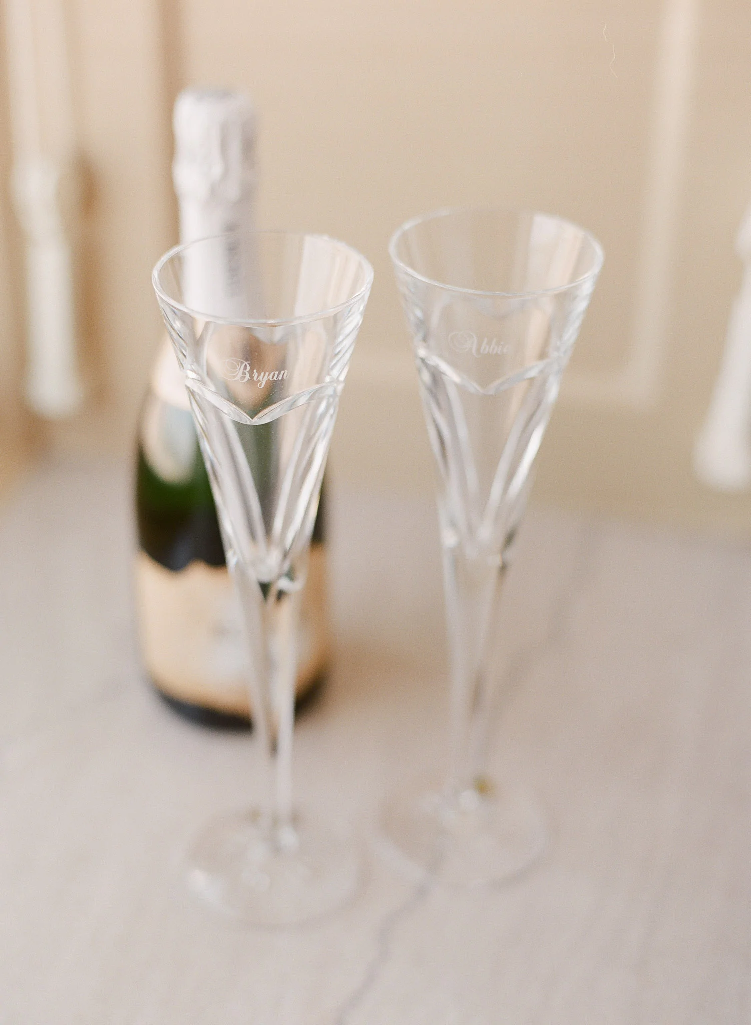 top destination wedding photographer lexia frank photographs the wedding of Green Bay Packer Bryan Bulaga and the custom crystal champagne glasses they used for their first toast, photographed on film, film photographer for weddings