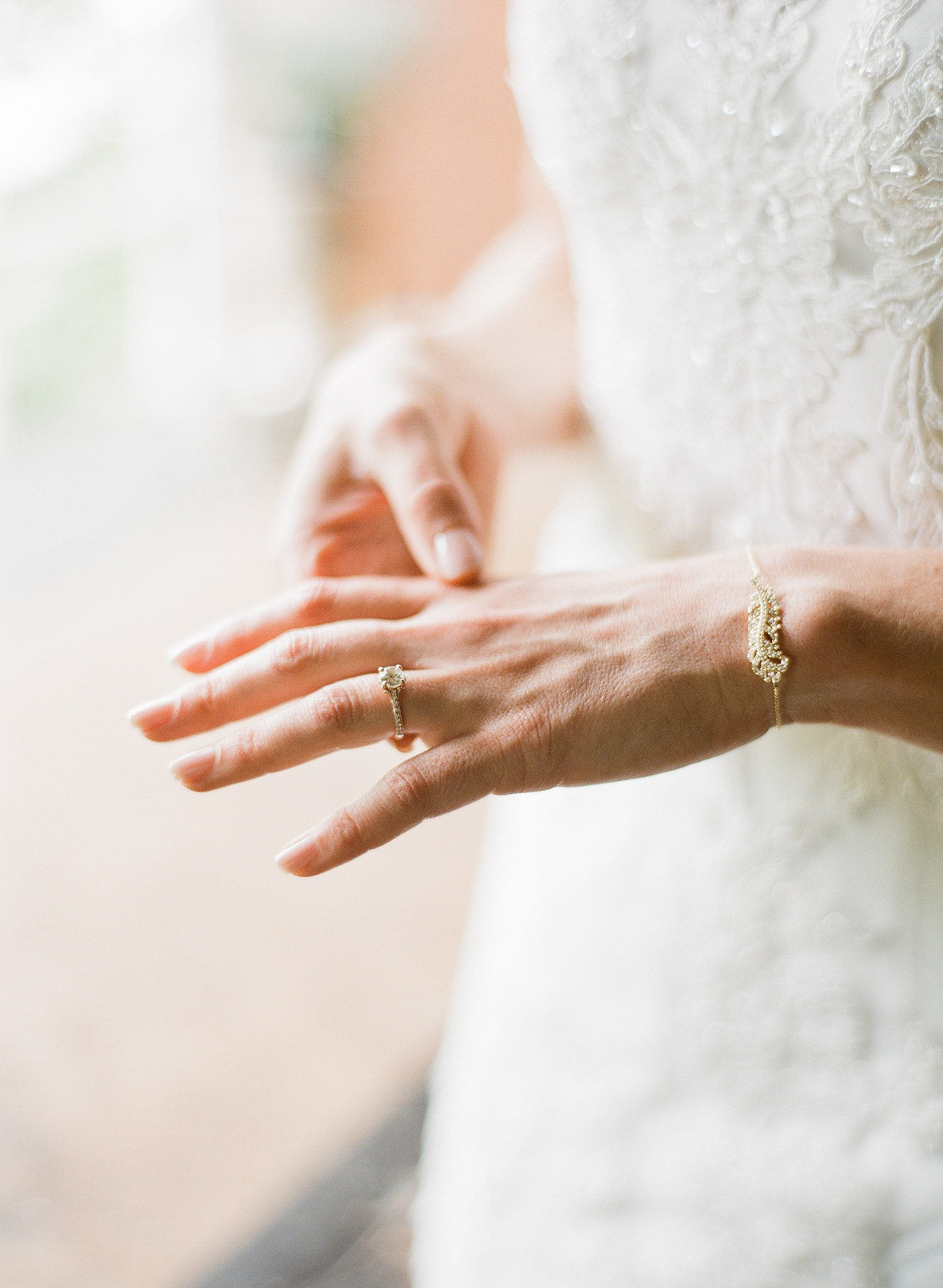 bride wears beautiful vintage jewelry for her wedding while destination wedding photographer Lexia Frank photographs this wedding on film at the Northwind Perennial Garden in wisconsin