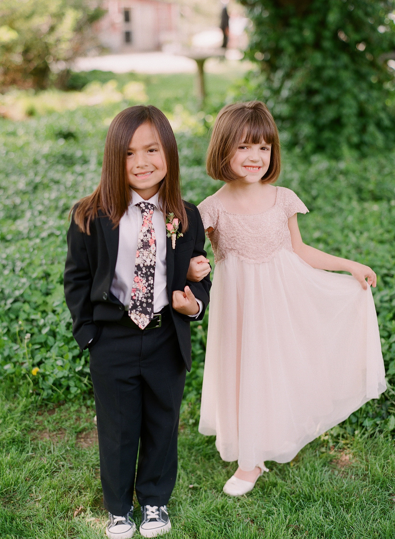 ring bearer and flower girl outfits are adorable at this springtime wedding at Northwind Perennial Garden - a beautiful wisconsin wedding venue - while Destination wedding photographer Lexia Frank Photographs this wedding on film