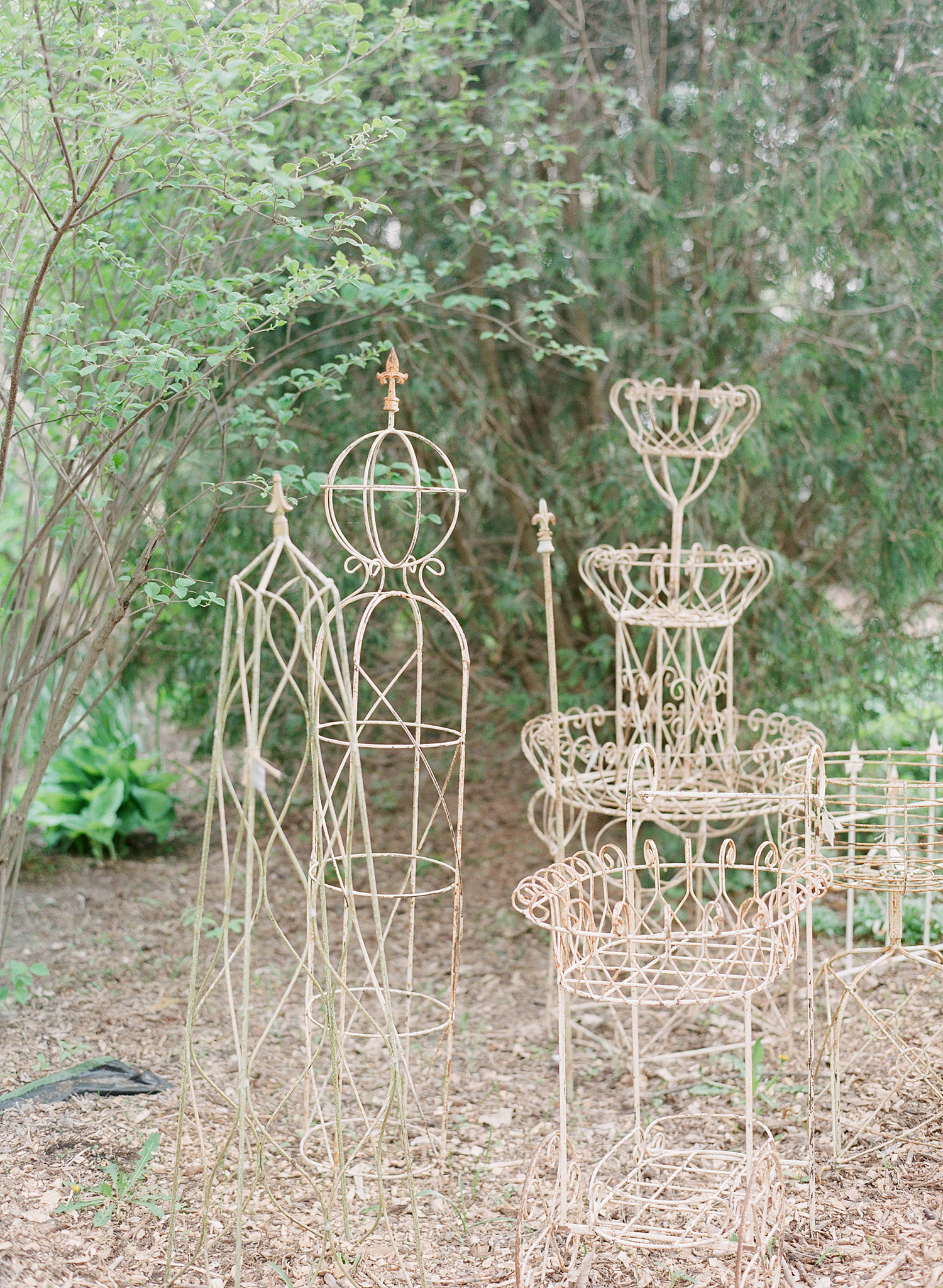 wrought iron garden items at this springtime wedding at Northwind Perennial Garden - a beautiful wisconsin wedding venue - while Destination wedding photographer Lexia Frank Photographs this wedding on film