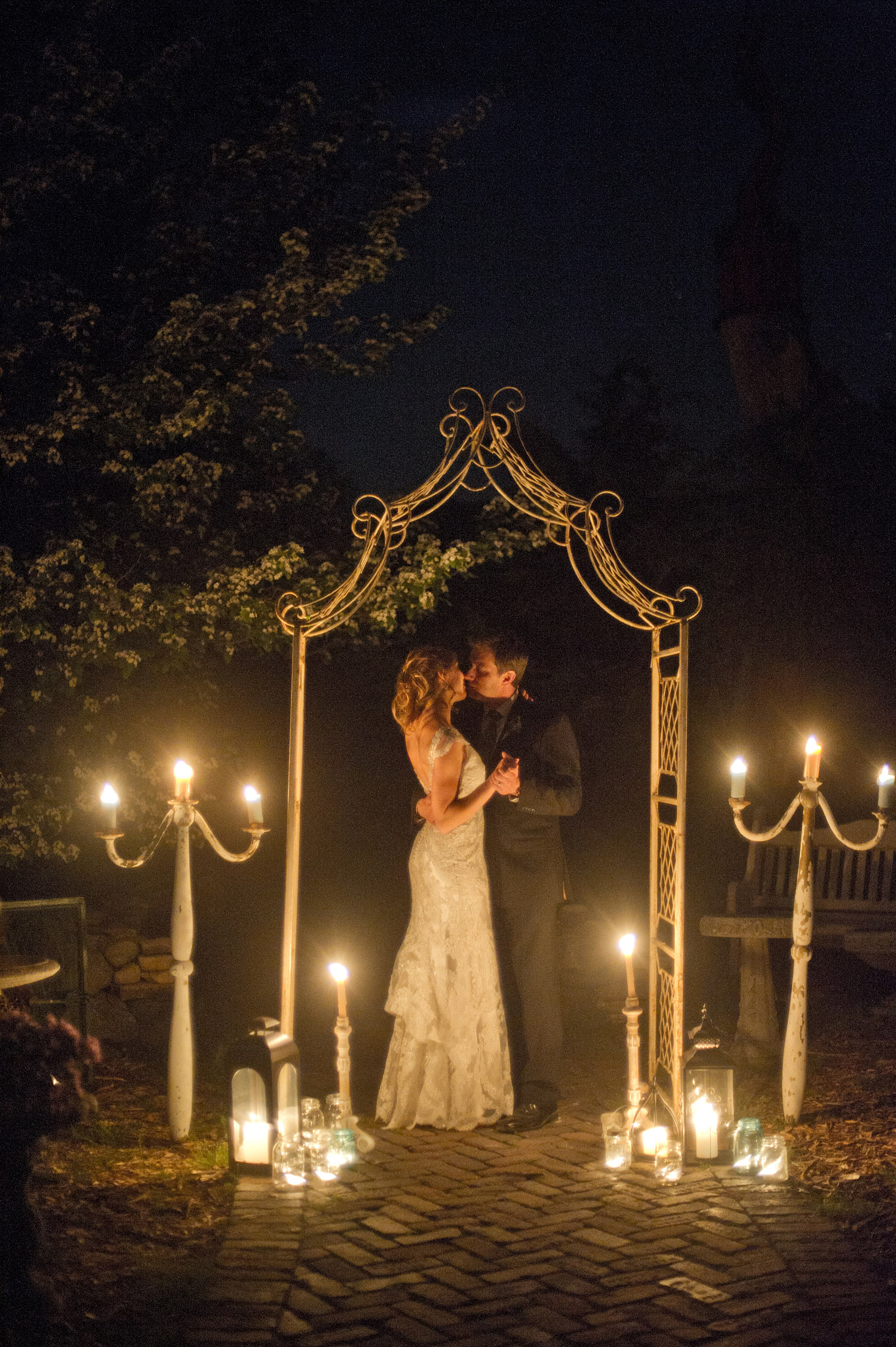 bride and groom share a nighttime photo session during the wedding at this springtime wedding at Northwind Perennial gardens - a wisconsin wedding venue - as a film wedding photographer Lexia Frank photographs this destination wedding on film