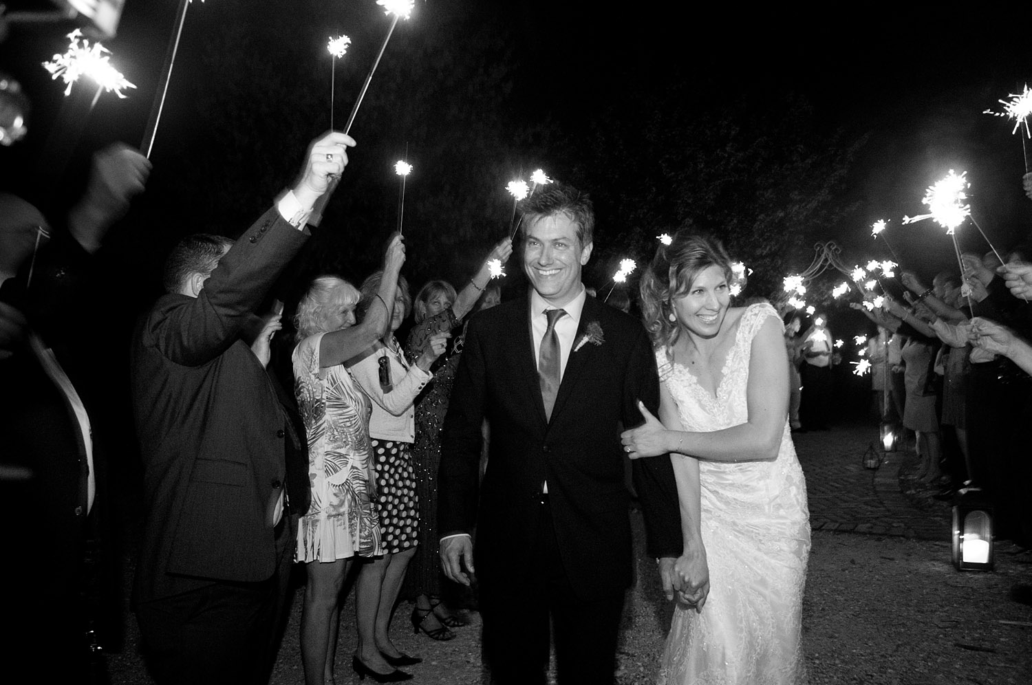 grand exit is a sparkler exit at this springtime wedding at Northwind Perennial gardens - a wisconsin wedding venue - as a film wedding photographer Lexia Frank photographs this destination wedding on film