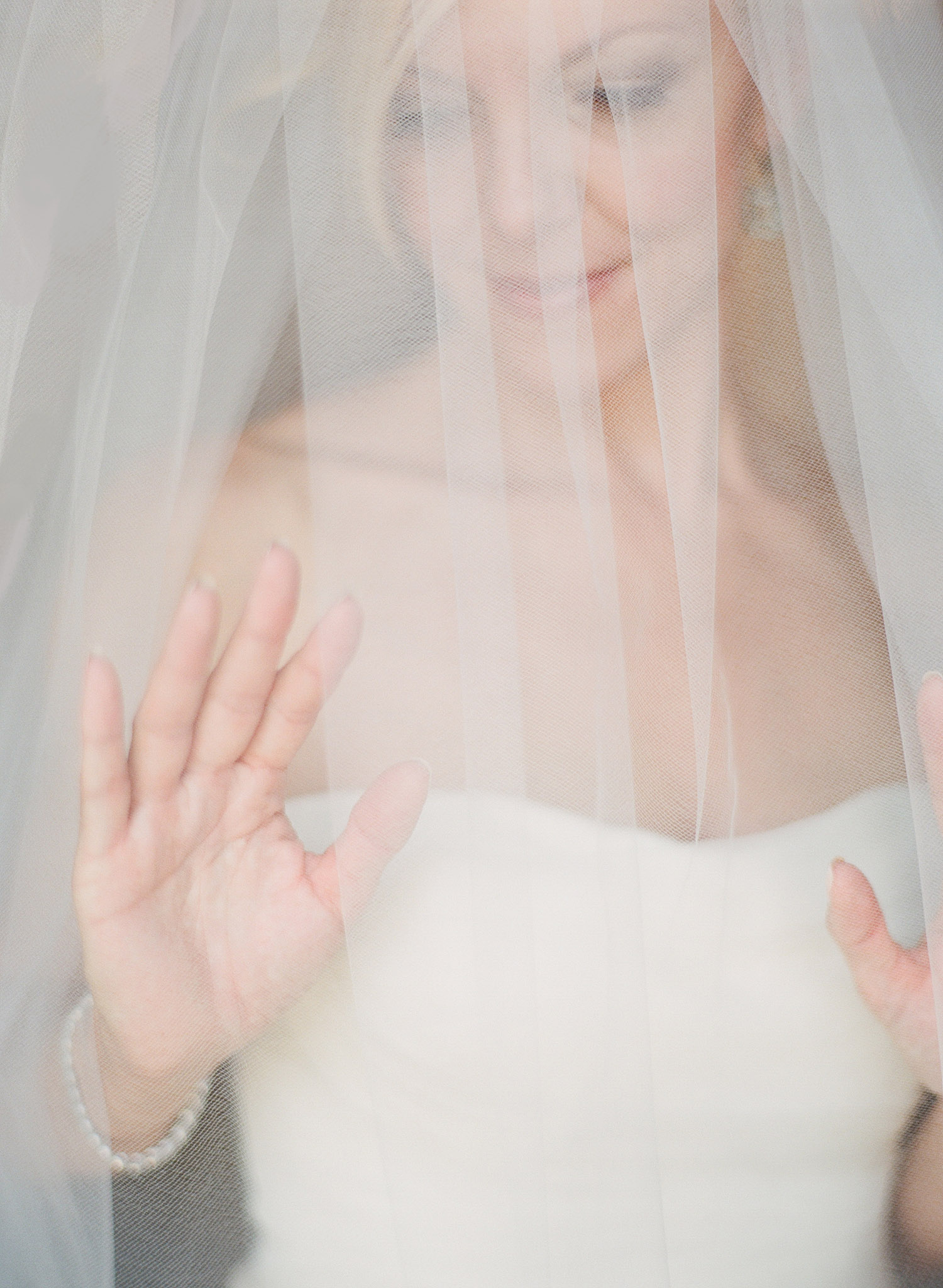 the bride is veiled at this beautiful Italian Villa Wedding at the Villa Terrace wedding where destination wedding photographer, lexia frank, photographs this villa terrace wedding photography entirely on film