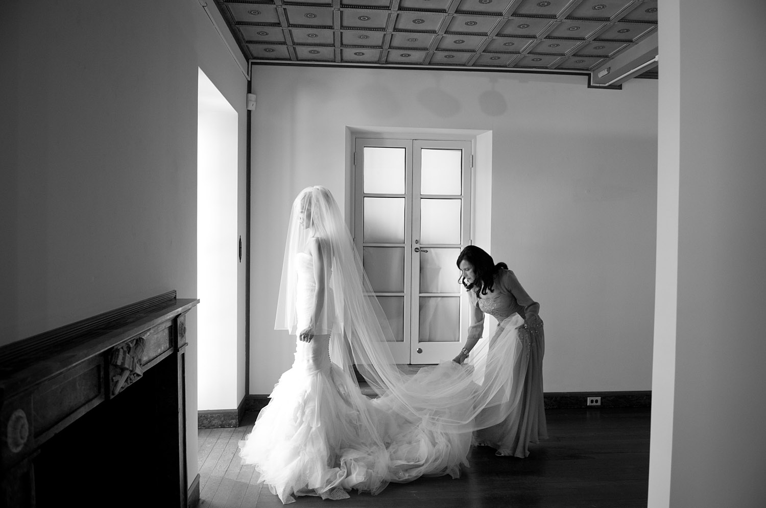 the mother of the bride puts the veil on the bride at this Italian Villa wedding at the Villa Terrace Wedding photographed by destination wedding photographer, lexia frank, who shot the entire wedding on film
