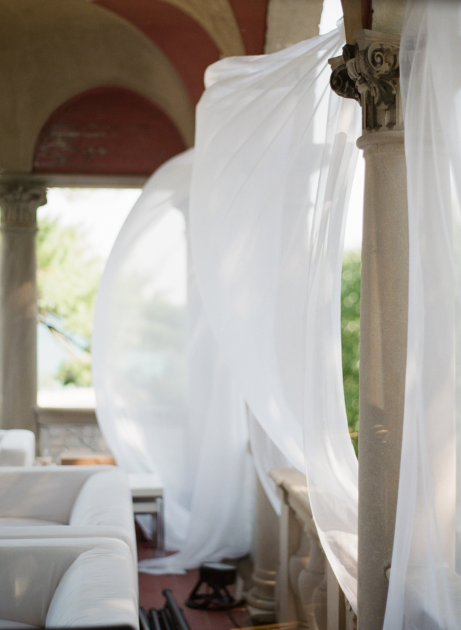 wind blows through silk at this Italian Destination Wedding at the Villa Terrace - a favorite wedding venue by Destination wedding photographer Lexia Frank who is a film photographer for weddings